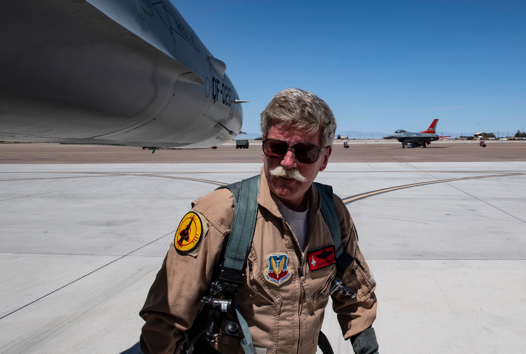 Jim Schreiner, Civilian QF-16 pilot/controller, preflights a QF-16 before a manned dress rehearsal of a missile test on a QF-16 at Holloman Air Force Base, New Mexico. (U.S. Air Force photo by Tech. Sgt. Perry Aston)