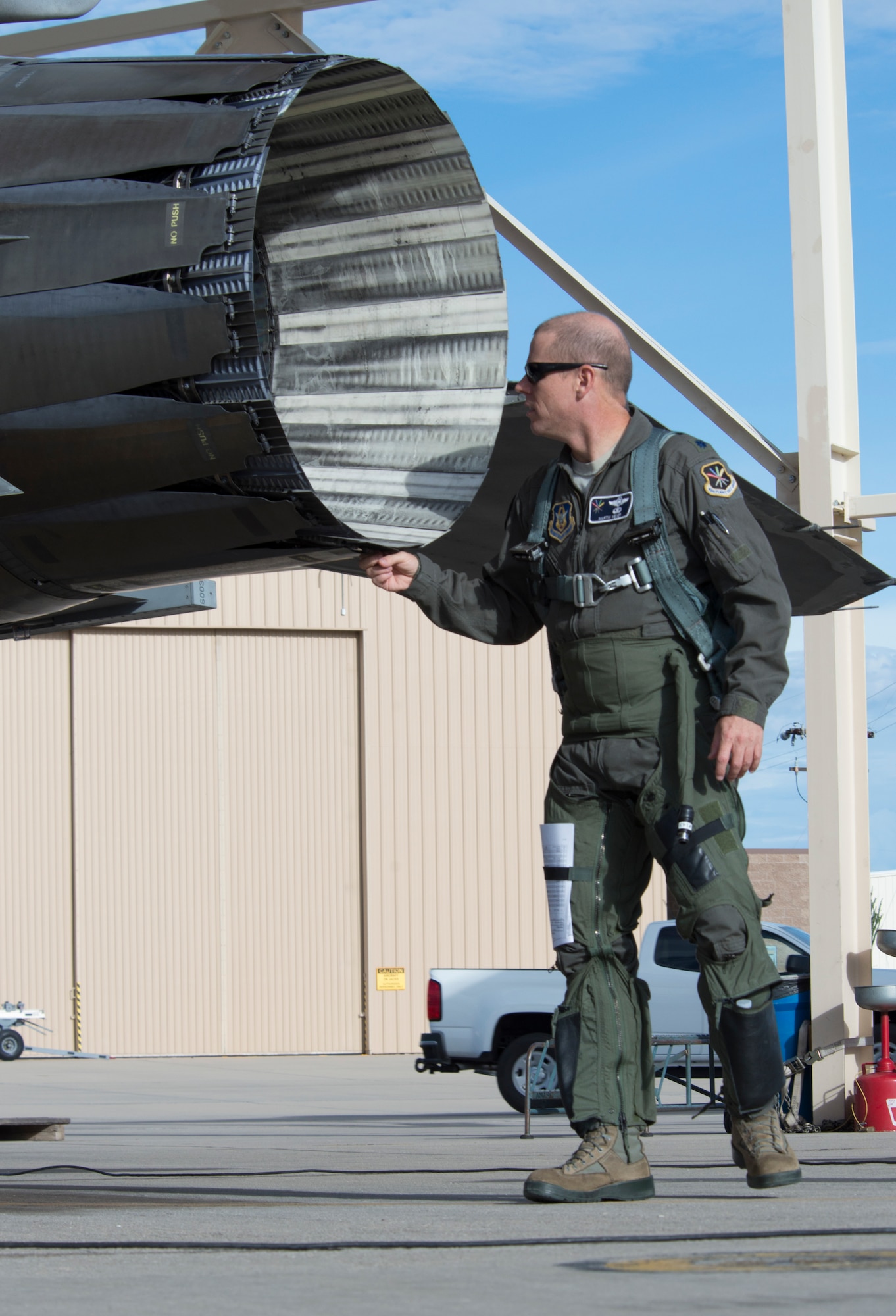 Lt. Col. Martin Meyer, the director of flight test at the Aerospace Maintenance and Regeneration Group, inspects a rebuilt F-16 Fighting Falcon, before he flies the aircraft to Cecil Field, Jacksonville, Fl., to be modified into a QF-16 unmanned aerial target. (U.S. Air Force photo by Tech. Sgt. Perry Aston)