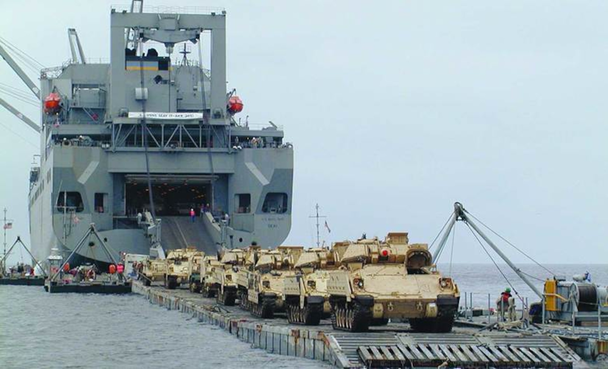 A Strategic Sealift Ship offloads Bradley Fighting Vehicles. (Military Sealift Command photo)