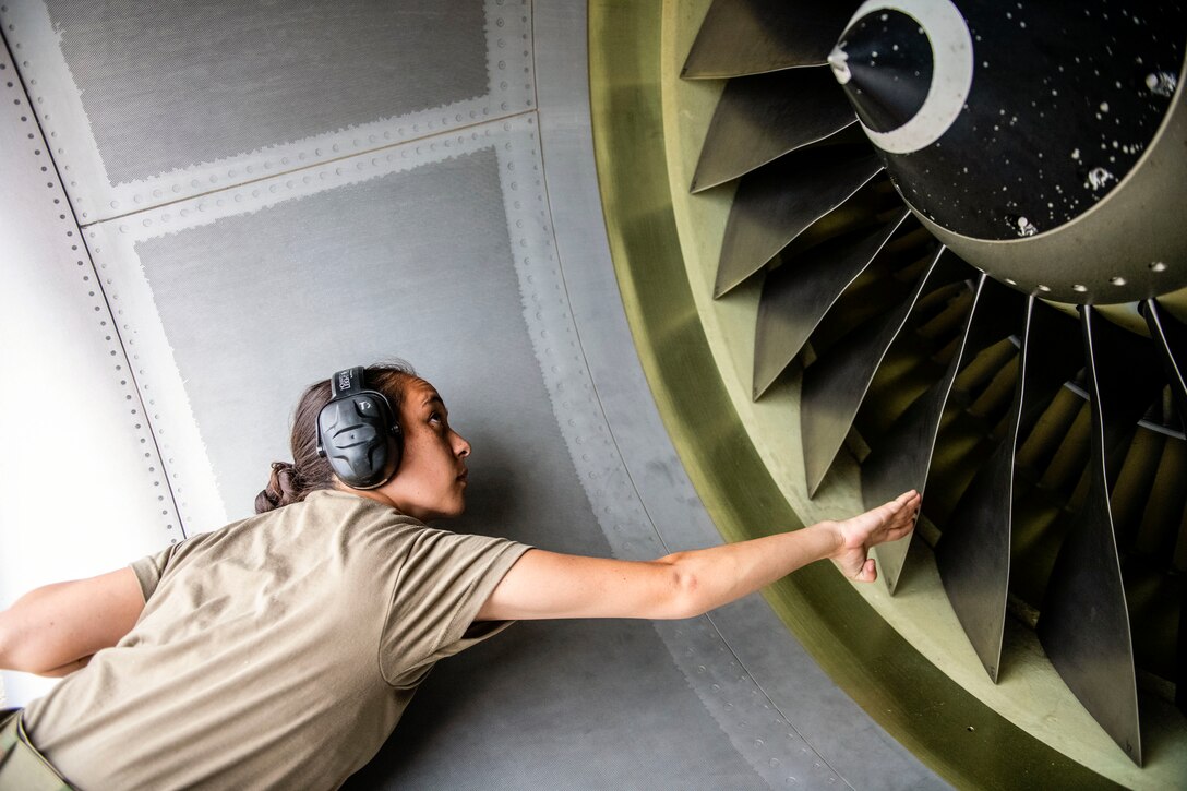 An airman works on an aircraft.