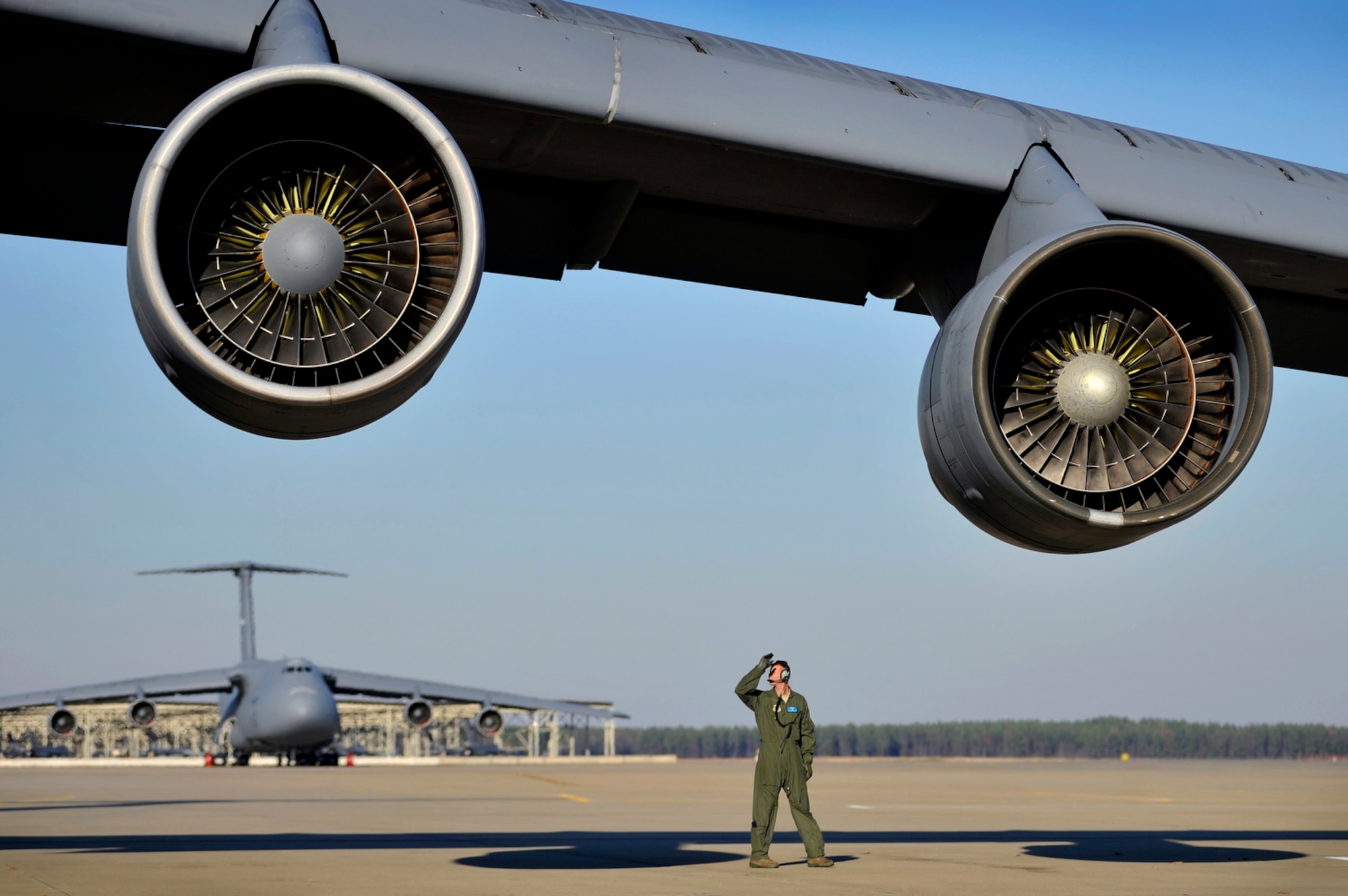 U.S. Air Force Tech. Sgt. Ryan Mozingo, 9th Airlift Squadron crew chief, performs a post flight inspection on C-5 Galaxy aircraft after arriving at Shaw Air Force Base, S.C., Jan. 6, 2012. Three C-5s landed at Shaw over a three day period to pick up airmen and supplies in support of a deployment tasking to Kunsan Air Base, South Korea. (U.S. Air Force photo/Senior Airman Kenny Holston)