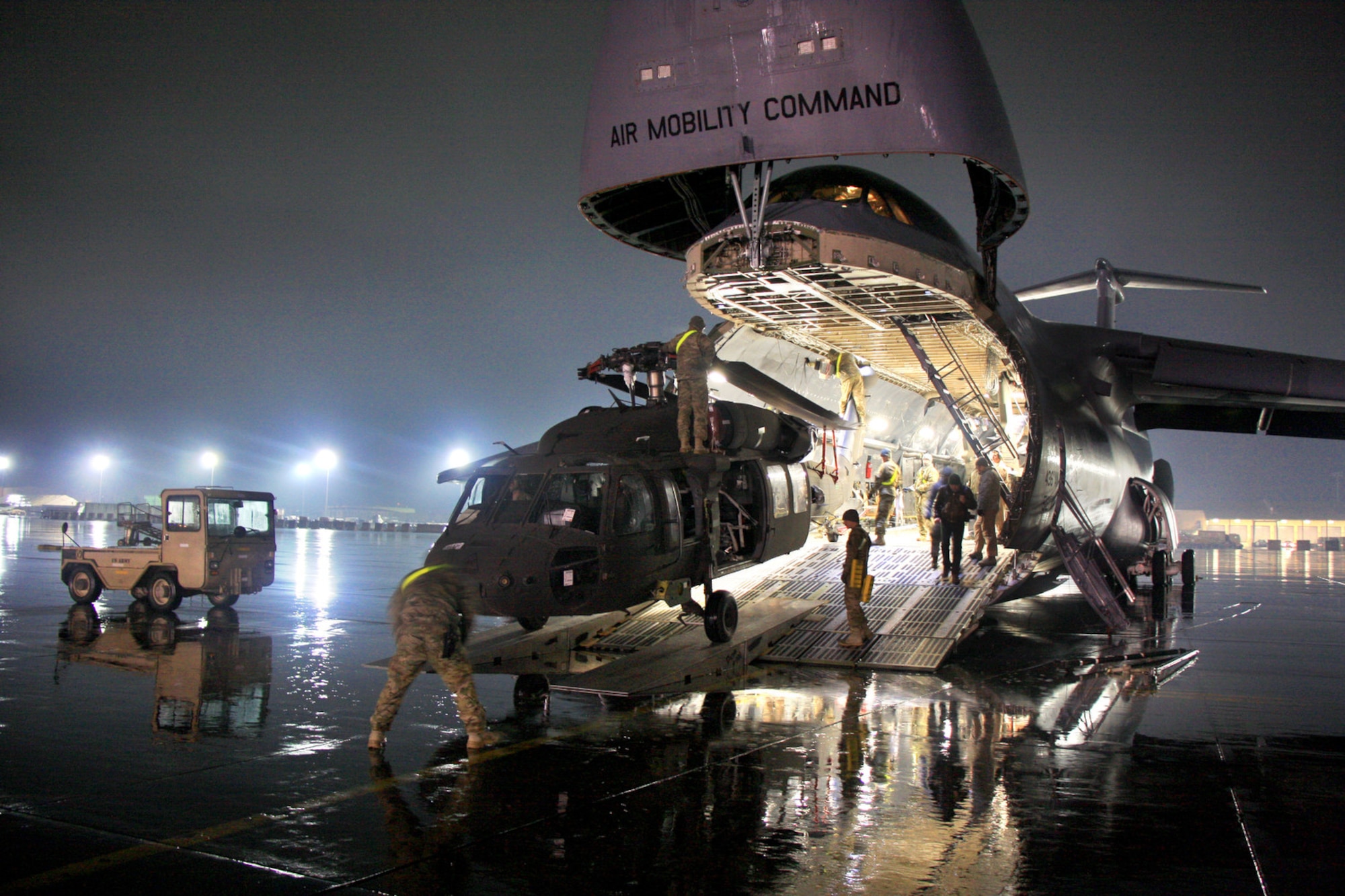 Soldiers and airmen offload A UH64 Black Hawk helicopter from a Lockheed C-5 Galaxy at Bagram Air Field. The C-5 Galaxy has served the U.S. Air Force since 1969, and continues to provide vital heavy air lift to troops worldwide. (U.S. Army photo by 1st Lt. Henry Chan, 18th Combat Sustainment Support Battalion Public Affairs)