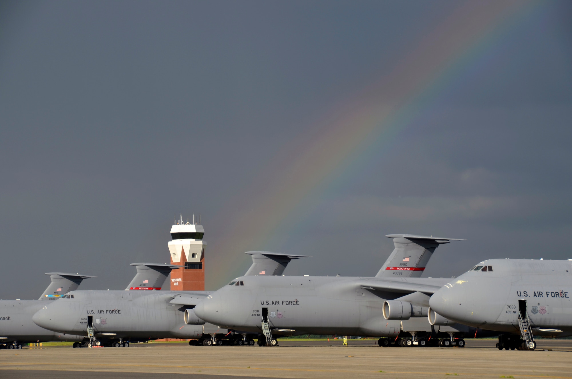 Westover's flight line hosts not only the Patriot Wing's 16 C-5Bs but also a re-engined Dover C-5M model, far left, May 25. The modernization of the C-5 boasts upgraded engines that deliver 22 percent more thrust, 30 percent shorter take-off roll and 58 percent faster climb rate, which allow cargo to be carried over longer distances without refueling. The engines are also three times quieter.  These upgrades earn this C-5 the title "Super Galaxy." (U.S. Air Force photo/SrA. Kelly Galloway)