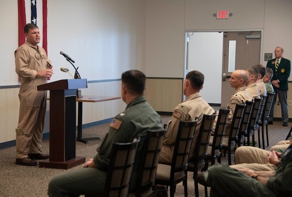 CORPUS CHRISTI, Texas (July 7, 2021) Chief of Naval Air Training Rear Adm. Robert Westendorff speaks after accepting the Adm. James S. Russell Naval Aviation Flight Safety Award from National Commander of the Order of the Daedalians retired Air Force Maj. Gen. Jerry Allen during a ceremony at Naval Air Station Corpus Christi, July 7. The award is a companion to the Navy Safety Center's Naval Aviation Readiness Through Safety Award. Selection for these annual awards is based on units' mishap rates, flight exposure, safety trends over the past three years, and aviation safety management system. (U.S. Navy photo by Lt. Michelle Tucker/Released)