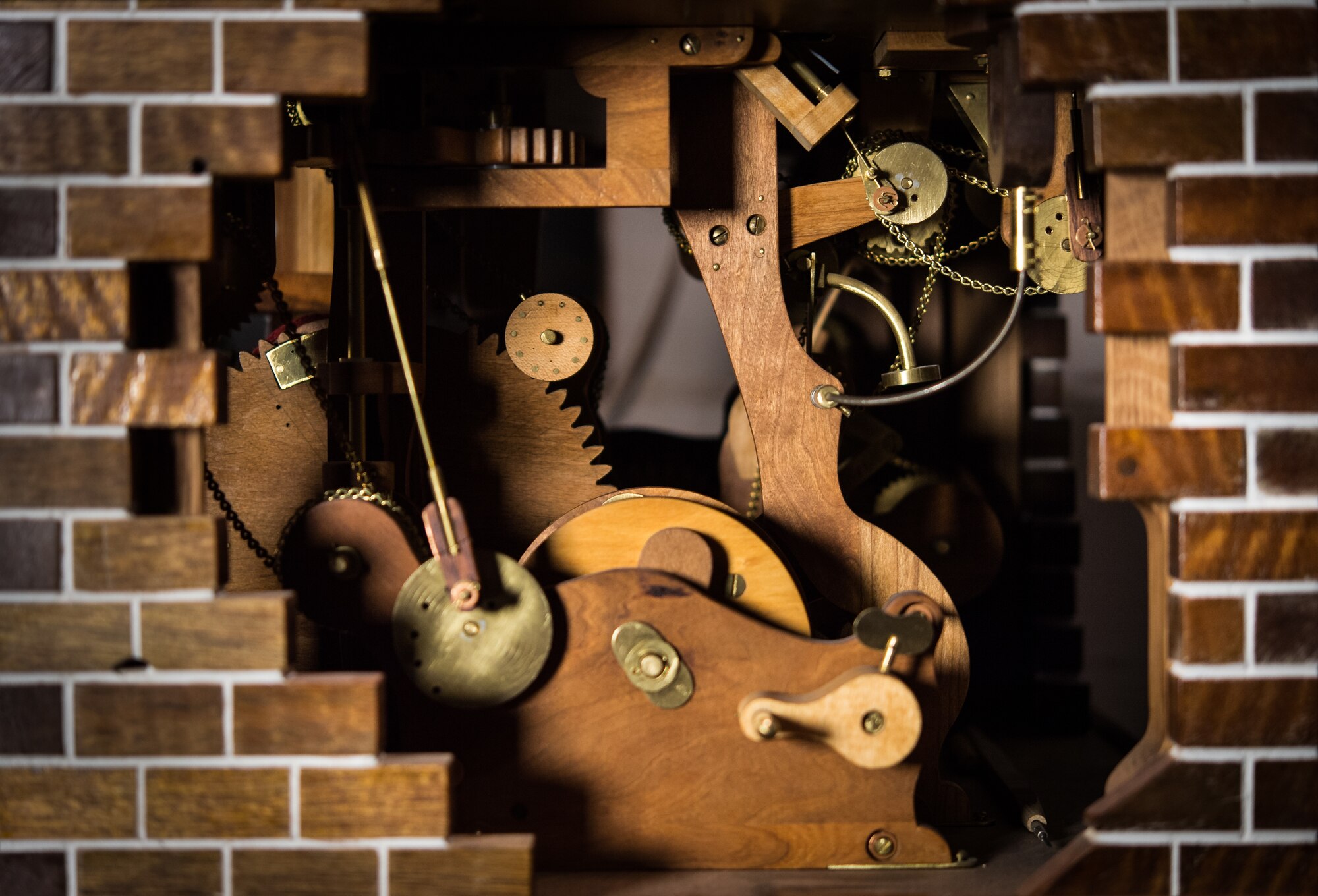 A mechanical folk art creation by retired U.S. Air Force Master Sgt. Daniel Holmes, uses handmade wooden gears, levers and cranks to operate at his home in Lowell, Mass., Jun. 1, 2018. Holmes utilizes his art to teach Airmen various electronic and mechanical skills not taught during their technical training in order for them to maintain 1960's era technology used at the Sagamore Hill Solar Observatory of the 2nd Weather Squadron, Det. 2, in Hamilton, Mass. (U.S. Air Force photo by J.M. Eddins Jr.)