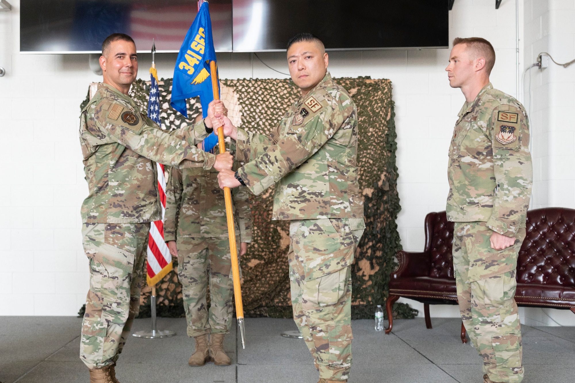 Lt. Col. Min Lee, 341st Missile Security Operations Squadron incoming commander, assumes command from Col. Frank Reyes, 341st Security Forces Group commander during a change of command ceremony July 7, 2021, at Malmstrom Air Force Base, Mont.