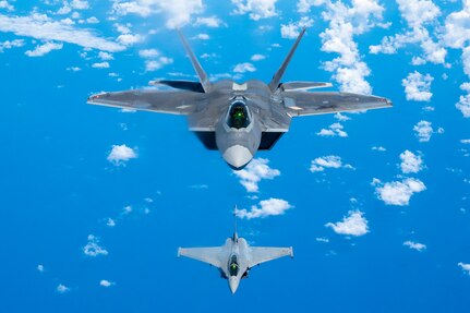 A Hawaii Air National Guard F-22 Raptor flies in formation with a French Air and Space Force F3-R Rafale June 30, 2021, near Oahu, Hawaii. FASF aircraft, maintenance, and support personnel traveled to Hawaii for exercise Wakea as part of the bilateral cooperation in the Pacific between the United States and France.