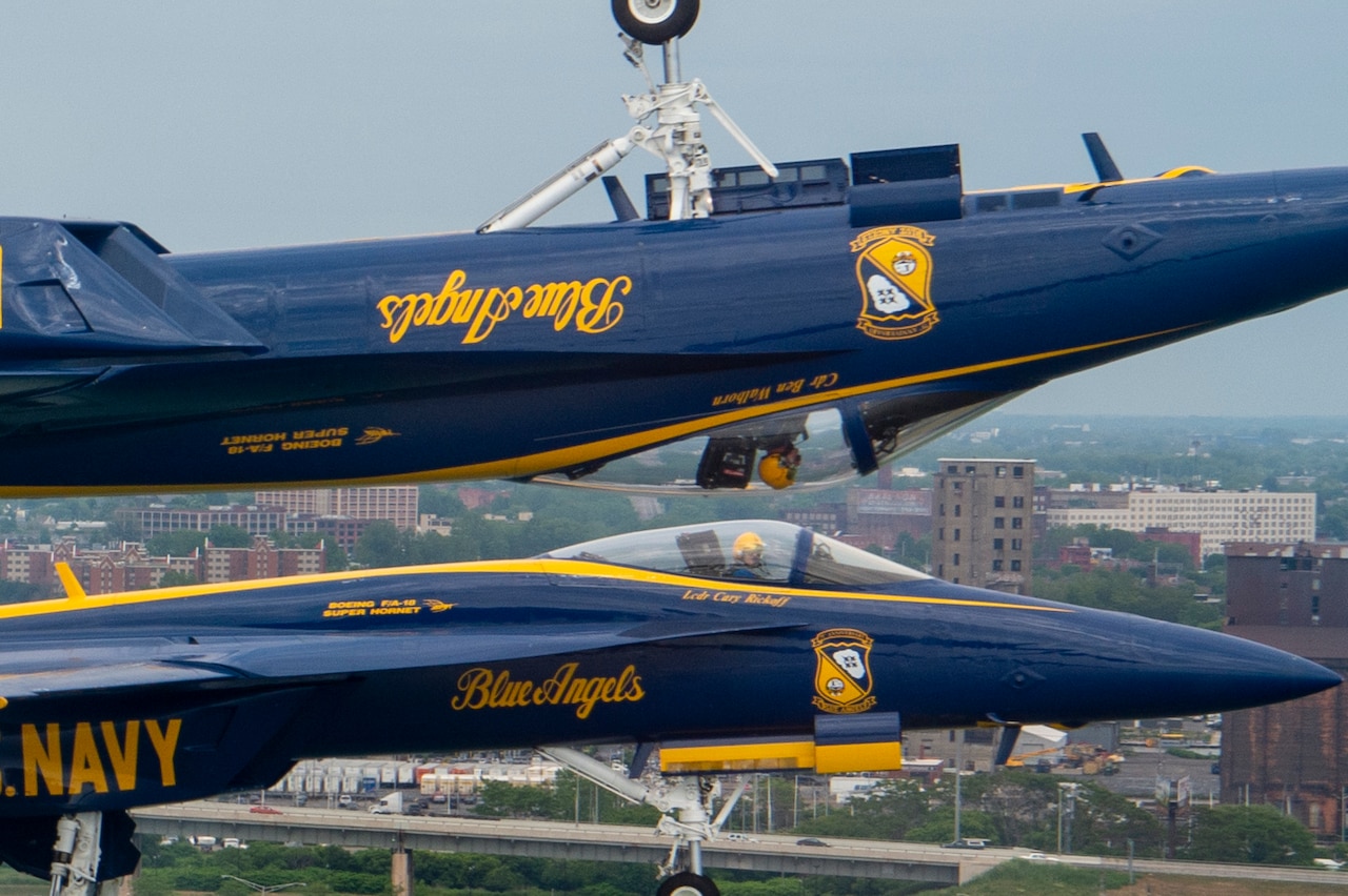 Aircraft travel parallel to each other.