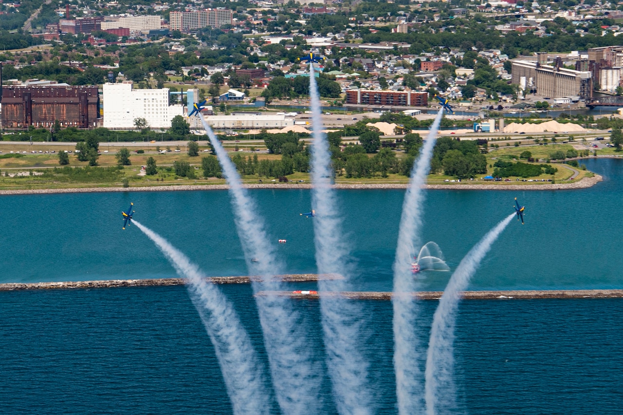 Aircraft fly in formation.