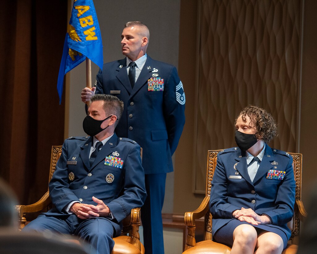 Cols. Paul Burger and Sirena Morris (seated) prepare for a leadership transition during the 88th Mission Support Group’s change-of-command ceremony July 1 in the Wright-Patterson Club. Morris took command of the group from Burger. (U.S. Air Force photo by R.J. Oriez)