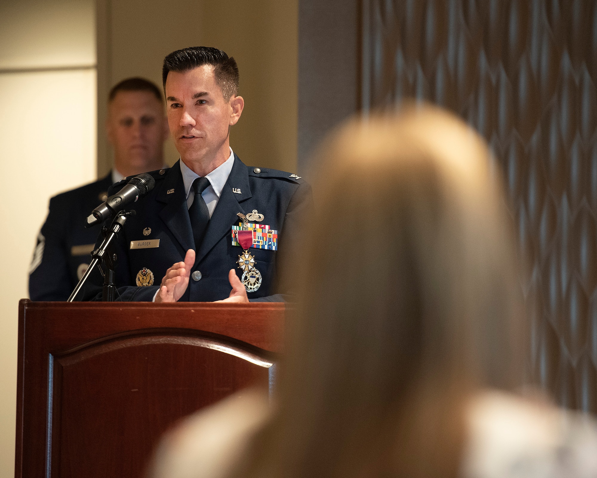 Col. Paul Burger says goodbye to the 88th Mission Support Group during the unit’s change-of-command ceremony July 1 in the Wright-Patterson Club. Burger relinquished command to Col. Sirena Morris. (U.S. Air Force photo by R.J. Oriez)