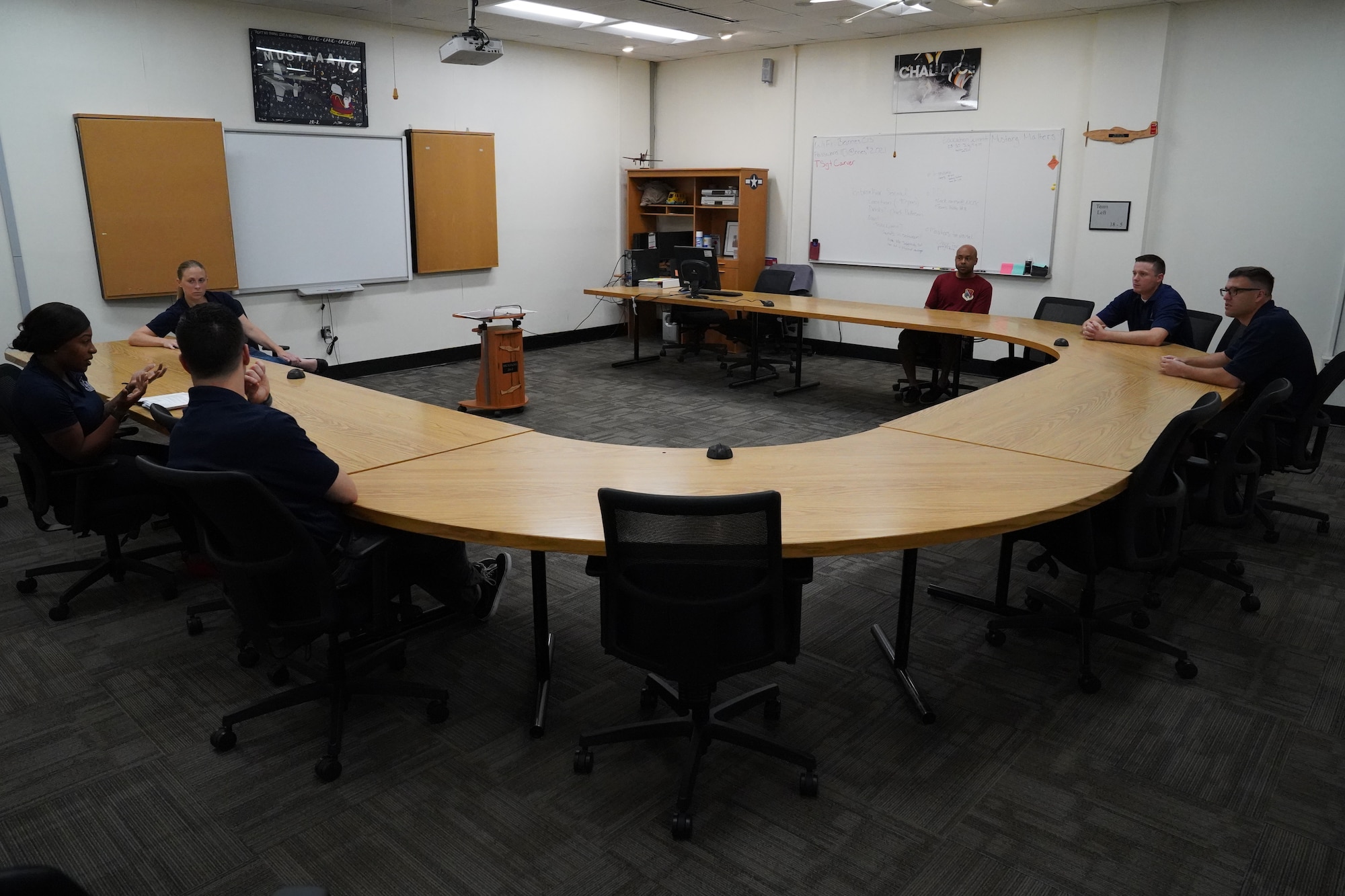 A team of professional military education instructors have a meeting inside the Mathies NCO Academy at Keesler Air Force Base, Mississippi, July 7, 2021. The Mathies NCO Academy host approximately 1,000 students each year, hoping to instill the quality leadership skills required to be an effective NCO. (U.S. Air Force photo by Senior Airman Spencer Tobler)