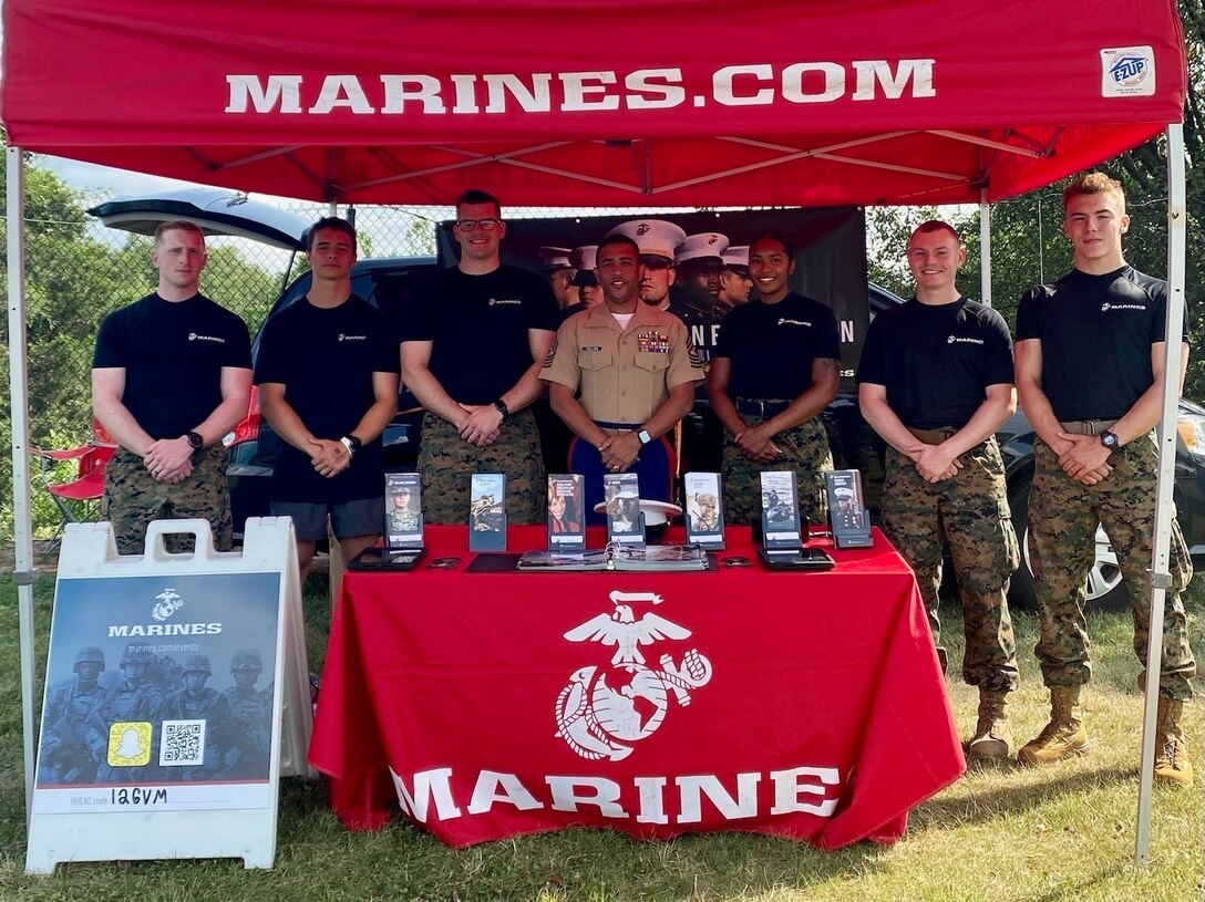 U.S. Marines from Recruiting Station Frederick, set up a table display at the Darn Good Country Weekend concert in Centreville, Virginia July 3, 2021. The Marines attended this event to speak with young men and women about enlistment in the U.S. Marine Corps. (U.S. Marine Corps photo by Sgt. Ryan Sammet)