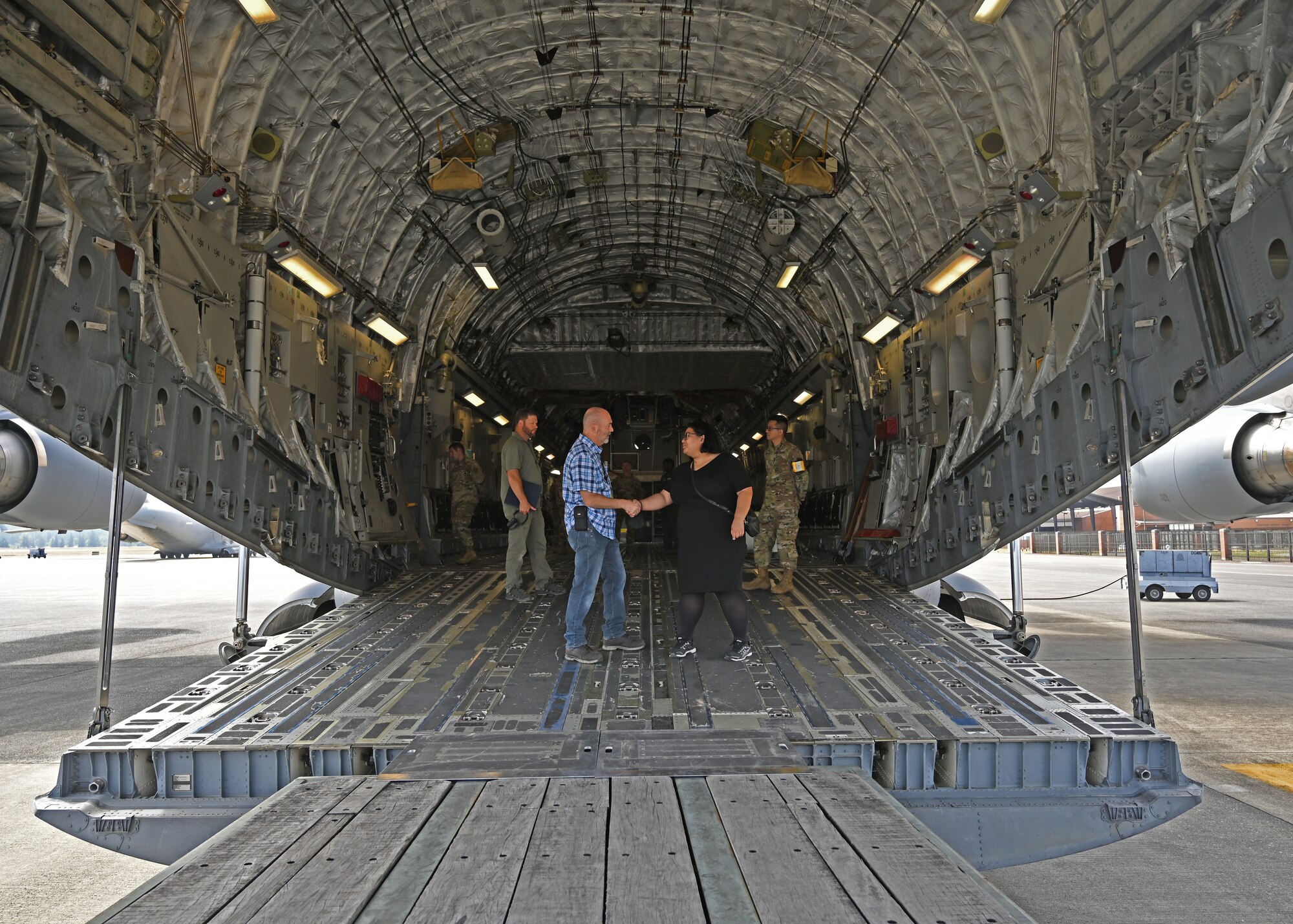 Betsy Dudley, military legislative assistant to U.S. Rep. Marilyn Strickland (WA-10), tours a C-17 Globemaster III with Jerry Miller, Prime Nuclear Airlift Force program coordinator with the 62nd Aerial Port Squadron, at Joint Base Lewis-McChord, Washington, July 6, 2021. Dudley oversees an issue portfolio encompassing defense, foreign affairs, veterans and intelligence issues. (U.S. Air Force photo by Airman 1st Class Callie Norton)