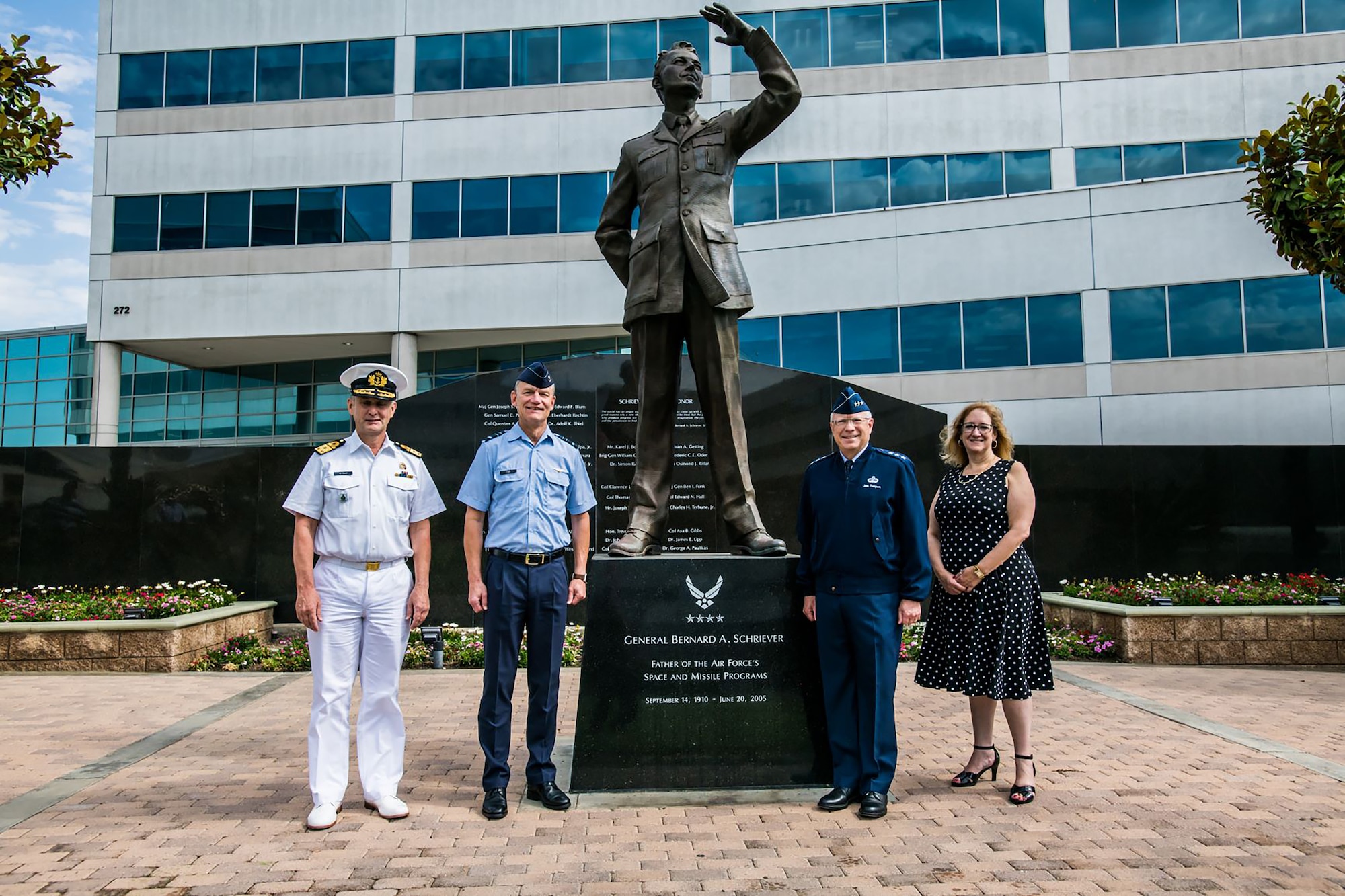 Vice Admiral Aire de Waard, the Netherlands director of Defence Material Command Organization, Lt. Gen. Dennis Luyt, commander of the Royal Netherlands Air Force, Lt. Gen. John F. Thompson, Space and Missile Systems Center commander and Department of the Air Force Program Executive Officer for Space, and Deanna Ryals, Chief Partnership Officer, stand in front of the Schriever statue at Los Angeles Air Force Base, California, July 8, 2021, demonstrating a global partnership between their respective nations. Leaders from the Dutch Ministry of Defence visited SMC to discuss the potential for joint capability development, cooperative agreements, and the need to adapt capabilities for current and future space threats. (U.S. Space Force photo by Van Ha)