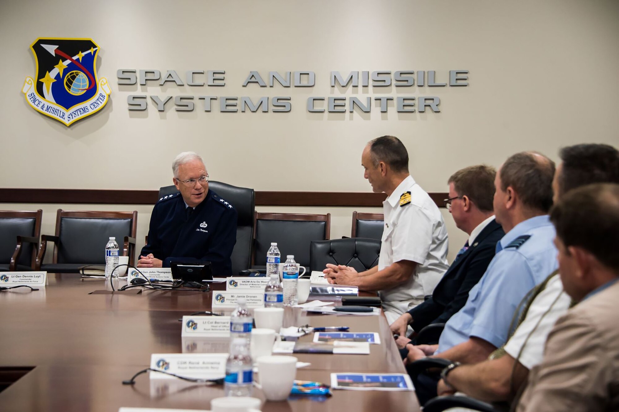 U.S. Air Force Lt. Gen. John F. Thompson, Space and Missile Systems Center commander and Department of the Air Force Program Executive Officer for Space, left, and attendees of an international partnership meeting discuss current and future military space efforts at Los Angeles Air Force Base, California, July 8, 2021. The U.S. Space Force recognizes the potential for cooperative agreements, joint capability development, and increased Dutch contribution to the NATO Alliance as an area favorable for engagement by U.S. and other allied stakeholders who seek to ensure space superiority. (U.S. Space Force photo by Van Ha)