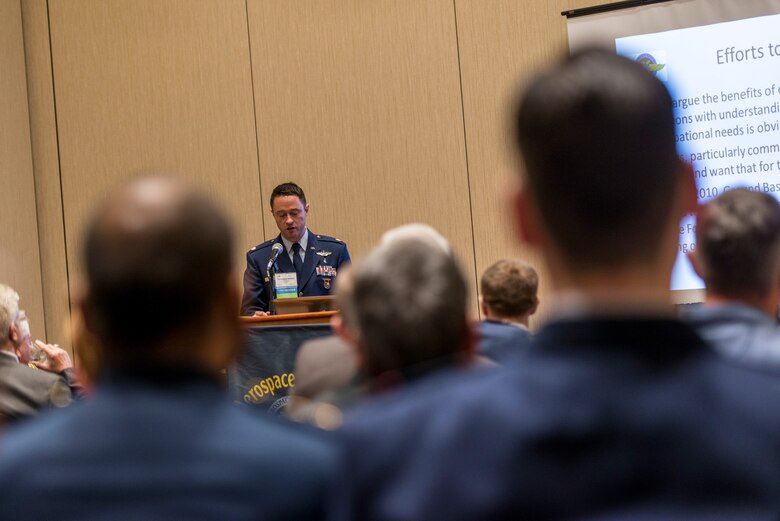 Maj. Chris Backus, a pilot-physician, briefs a group of doctors during an aerospace medicine conference in New Jersey, April 28, 2016. Pilot-Physicians are involved in the research, development, testing, and evaluation of new and current Air Force systems and missions as early as possible to realize the greatest effectiveness and cost savings. Because of unique medical and human factors qualifications pilot-physicians are particularly well-suited to help develop new aircraft, life support equipment, and avionics or software upgrades, and to ensure that changing missions can be accommodated by crews and aircraft. (U.S. Air Force photo/Master Sgt. Brian Ferguson)