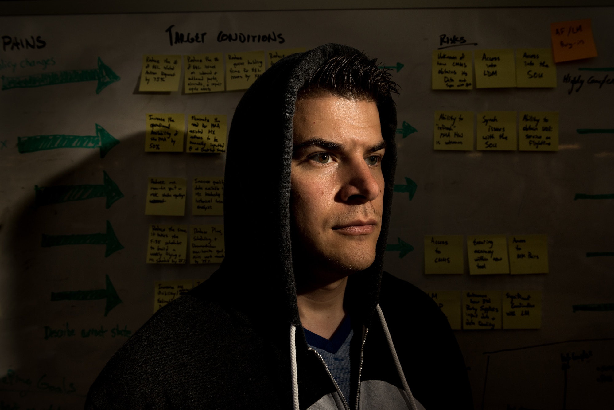 Capt. Bryon Kroger, who is stationed at Hanscom Air Force Base, Mass., is photographed in the offices of Kessel Run, an agile Air Force software development program in Boston, where he spent the last two years launching the program with help from the Defense Innovation Unit Experimental, and serving as the chief operating officer running the day-to-day operations. Kessel Run teams Air Force coders and procurement officers with private industry to employ innovative techniques to develop software solutions for the warfighter in weeks and months instead of years. (U.S. Air Force photo by J.M. Eddins Jr.)