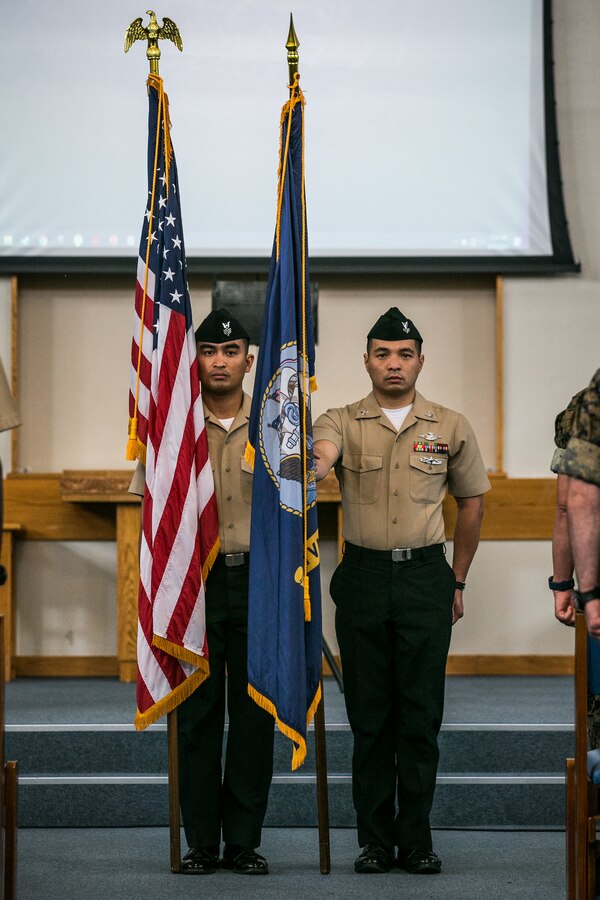 U.S. Navy HM1 Carlo Conrado Limos, left, and HM2 Ferdinand Chua, both Fleet Marine Force hospital corpsmen with Combat Logistics Regiment 37, 3d Marine Logistics Group, stand at the position of attention during the 123rd Navy Hospital Corpsman Birthday ceremony on Camp Kinser, Okinawa, Japan, June 17, 2021. Established in 1898 during the Spanish-American war, the U.S. Naval Hospital Corps remains the most versatile and decorated of any rating in the Navy with 39 different Navy Enlisted Classifications, 23 Congressional Medals of Honor, 179 Navy Crosses, 959 Silver Stars, and over 1,600 Bronze Stars. Fleet Marine Force Corpsmen provide Marine Corps units with the capability of medical services in all environments and conditions. 3d MLG, based out of Okinawa, Japan, is a forward deployed combat unit that serves as III MEF’s comprehensive logistics and combat service support backbone for operations throughout the Indo-Pacific area of responsibility. (U.S. Marine Corps photo by Sgt. Hailey D. Clay)