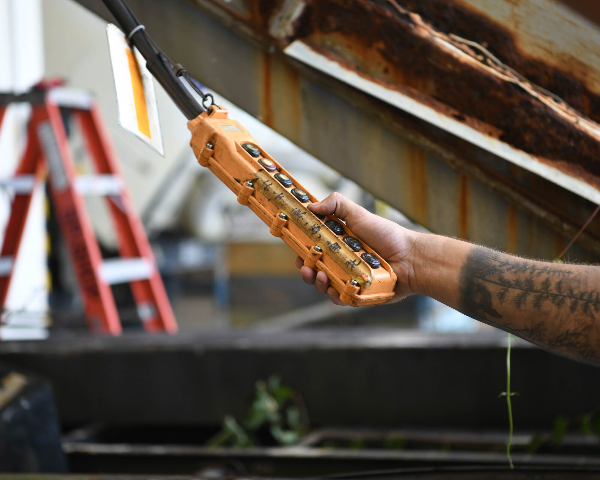 Special Purpose technicians work on disassembling a staircase truck at Kadena Air Base, Japan, June 16, 2021.