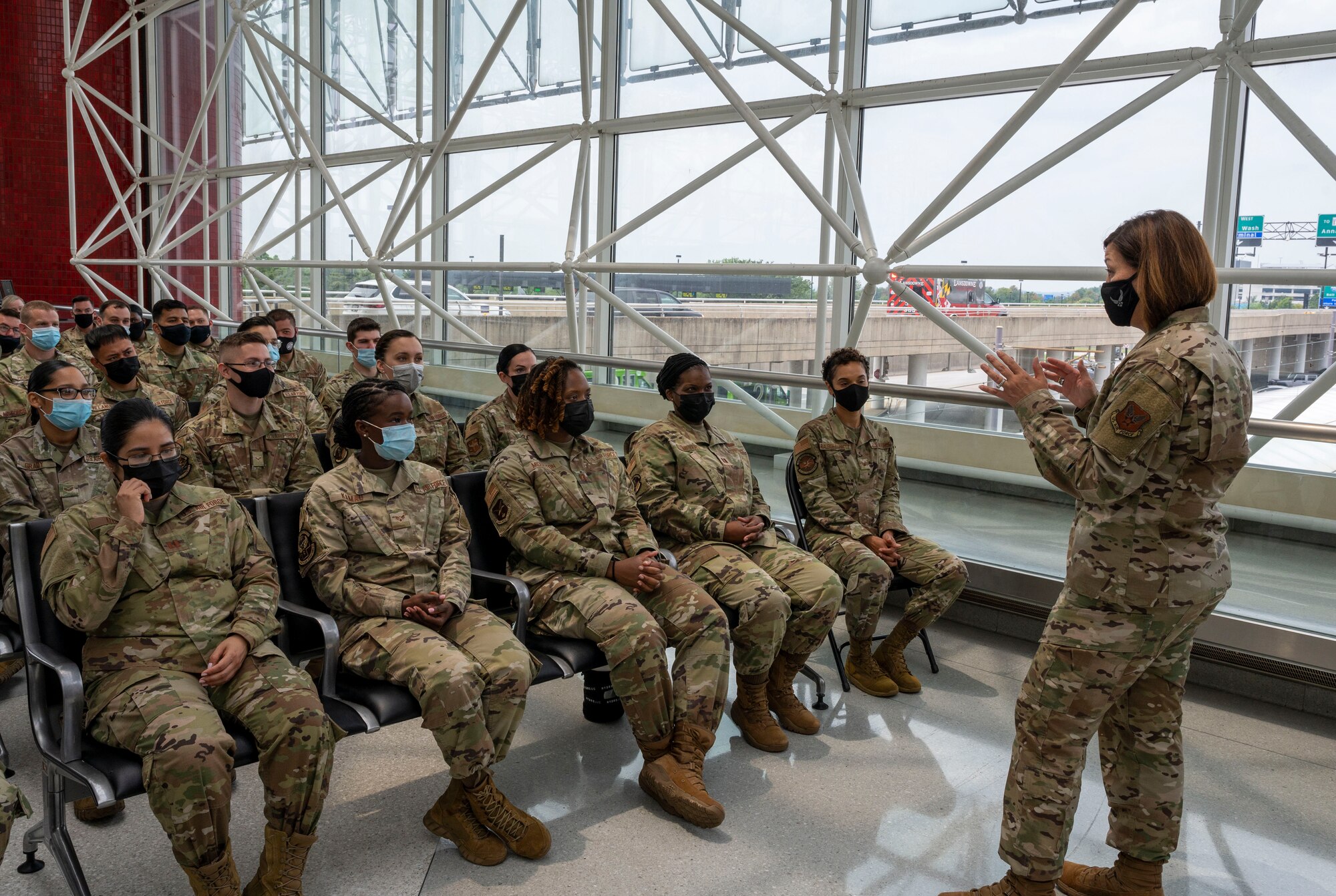 Chief Master Sgt. of the Air Force JoAnne S. Bass speaks with Airmen at the Patriot Express COVID-19 testing facility in the Baltimore/Washington International Thurgood Marshall Airport in Baltimore, July 8, 2021. Over 22,000 rapid, on-site, COVID-19 tests were administered by Air Force medical professionals deployed to Air Mobility Command aerial ports of embarkation. Due to the increased availability in COVID-19 testing centers and vaccines, testing at the BWI facility is scheduled to discontinue July 15, 2021. (U.S. Air Force photo by Airman 1st Class Cydney Lee)