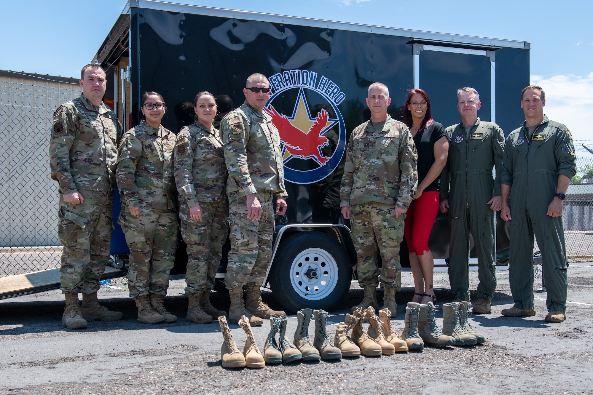 Col. Brett Newman, 419th Maintenance Group commander, poses with members from the 419th and 388th Fighter Wings in front of boots collected for the Operation Hero Boot Drive at Hill Air Force Base, Utah on July 7, 2021.