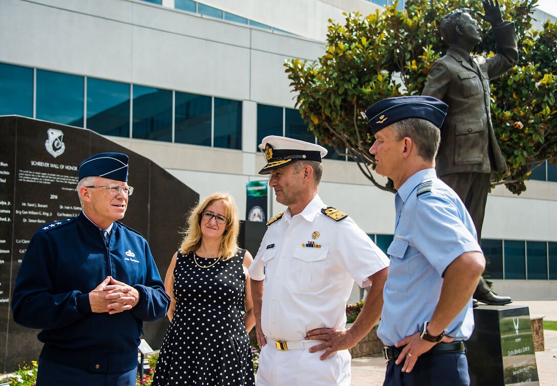 U.S. Air Force Lt. Gen. John F. Thompson, Space and Missile Systems Center commander and Air Force Program executive officer for Space, and Deanna Ryals, Chief Partnership Officer, meet with Vice Admiral Aire de Waard, the Netherlands director of Defence Material Organization, and Lt. Gen. Dennis Luyt, commander of the Royal Netherlands Air Force, before the start of an international partnership meeting at Los Angeles Air Force Base, California, July 8, 2021. The U.S. government is looking to broaden collaboration and partnerships with the Netherlands in several military space mission areas growing from our strong collaboration in MILSATCOM and responsive space capabilities. (U.S. Space Force photo by Van Ha)