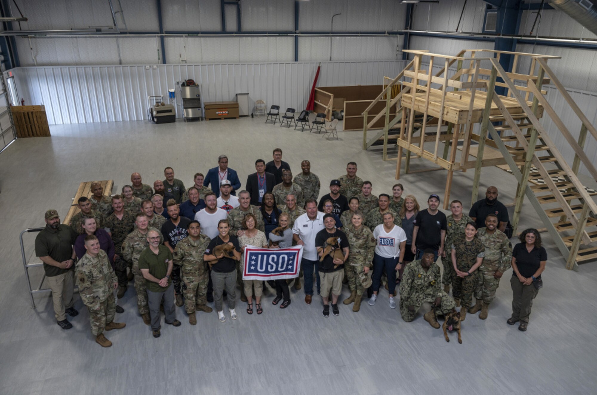 A group photo of military and civilian members during the USO Tour at Joint Base San Antonio.