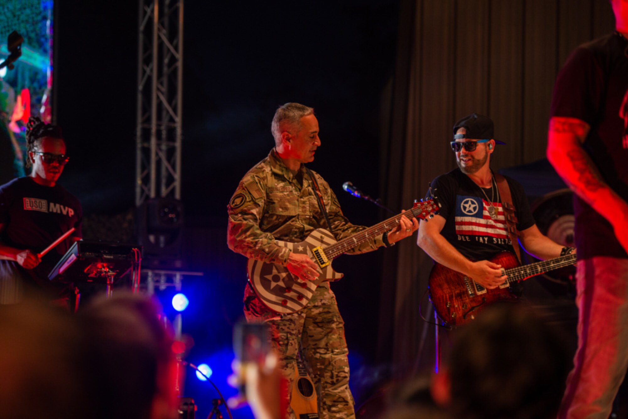 SEAC Ramón "CZ" Colón-López performs on stage with the band LOCASH during the USO Summer Tour at Joint Base San Antonio-Lackland.