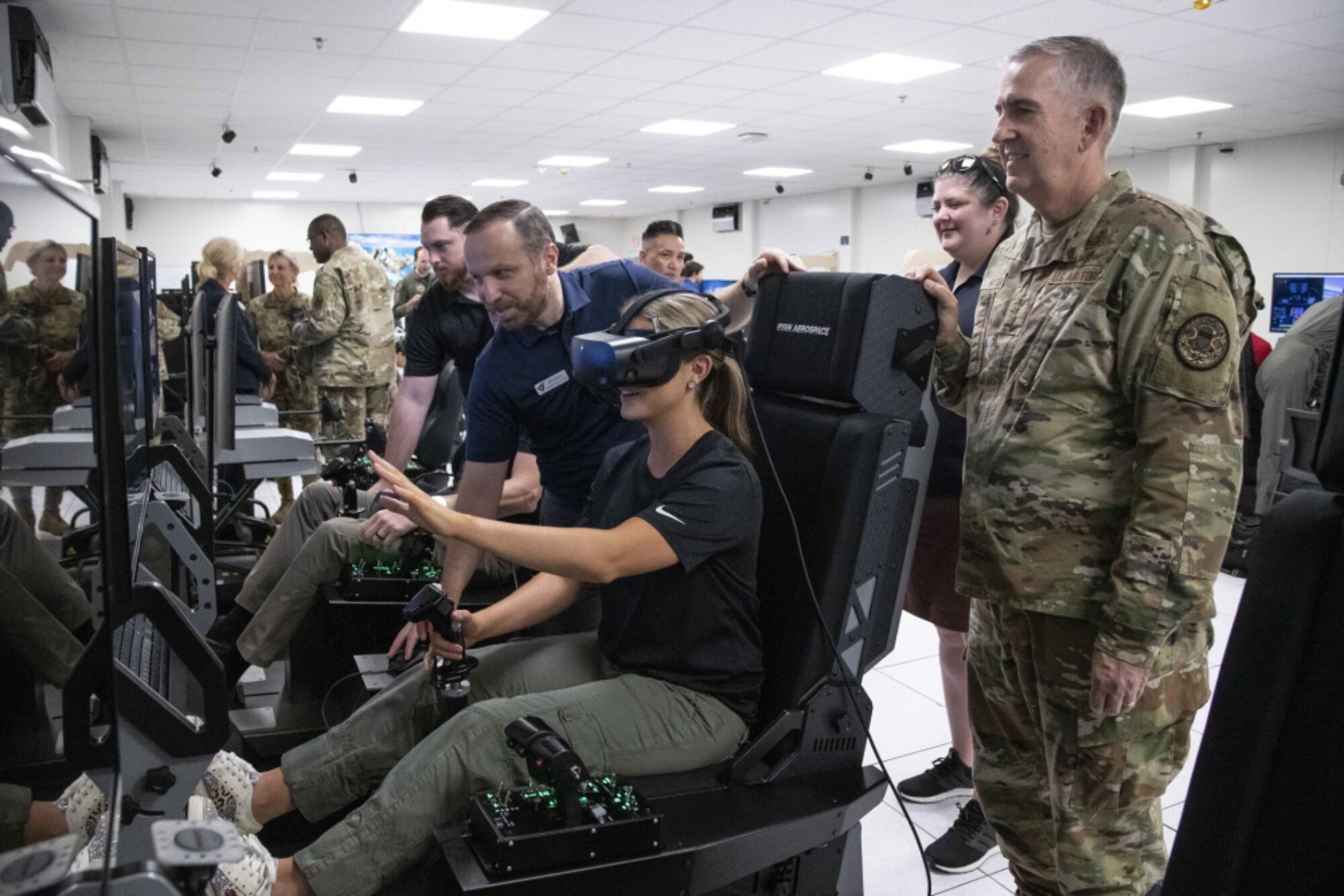 Miss America Camille Schrier uses a virtual reality flight simulator at Joint Base San Antonio-Randolph.