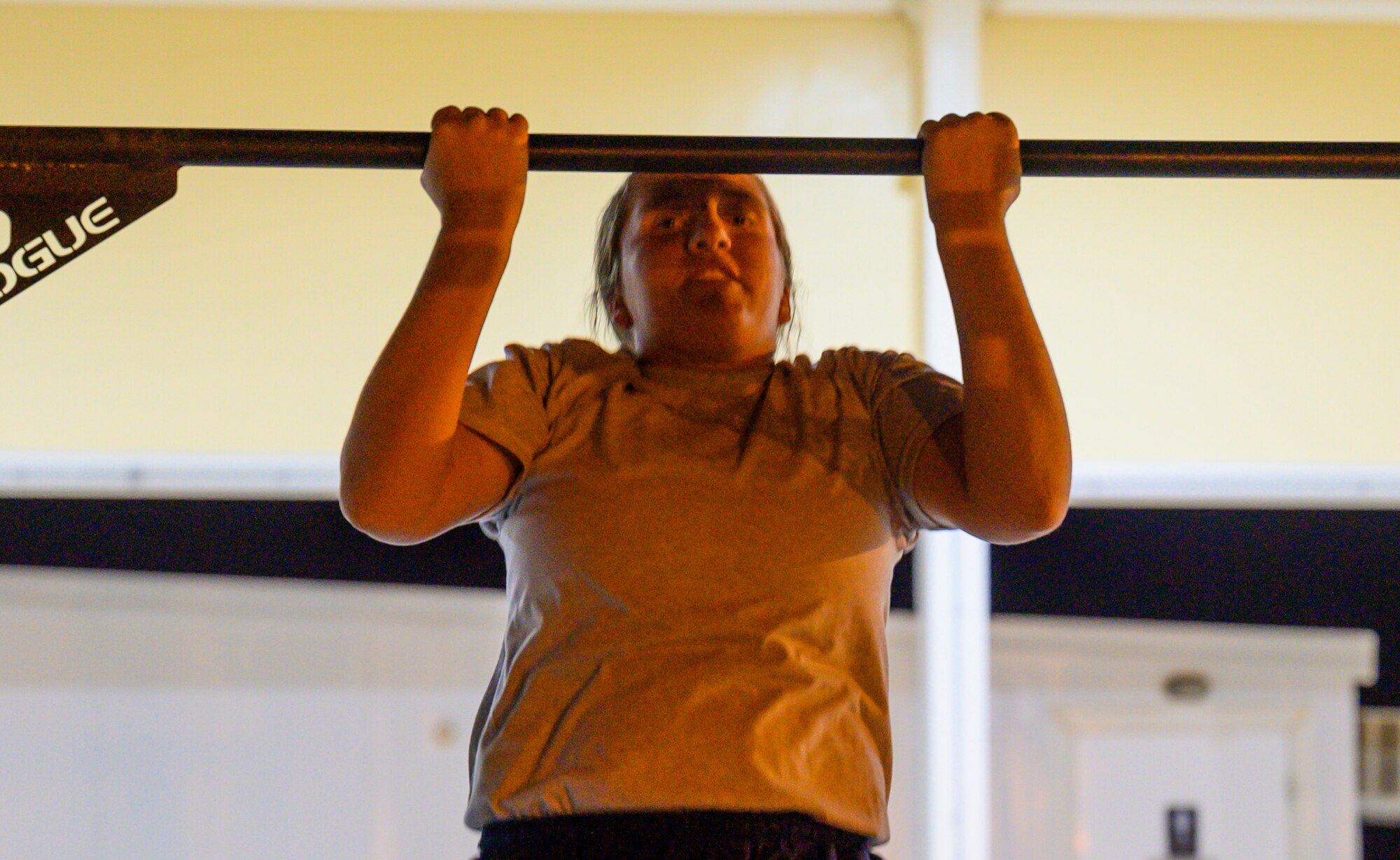 U.S. Air Force Staff Sgt. Susanna Schriever, 378th Expeditionary Medical Squadron medic, accomplishes the pull-up portion of the first best medic competition at Prince Sultan Air Base, June 21, 2021. The competition was a culmination of the past 11 weeks of combat medicine training, testing their ability to provide care in unexpected situations. (U.S. Air Force photo by Senior Airman Samuel Earick)