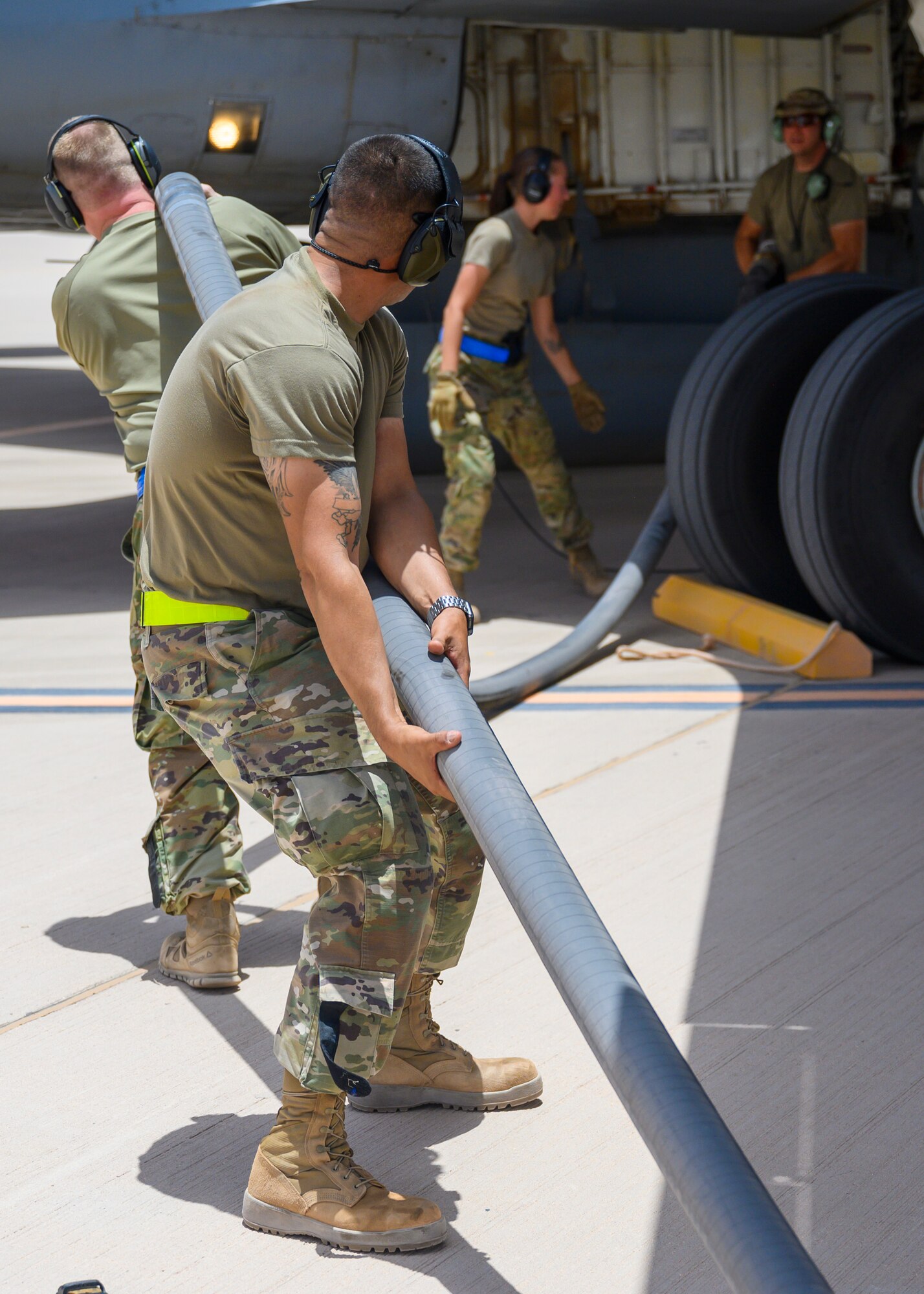 U.S Airmen of the 378th Expeditionary Operations Group conduct a hot-pit refueling on an U.S. Air Force KC-135 Stratotanker, Prince Sultan Air Base, June 25, 2021. This event demonstrated the success of several weeks of hot-pit refueling cross-airframe training between 378th and 379th Air Expeditionary Wing maintainers, expanding both Wings ability to provide agile support for theater operations. (U.S. Air Force photo by Senior Airman Samuel Earick)