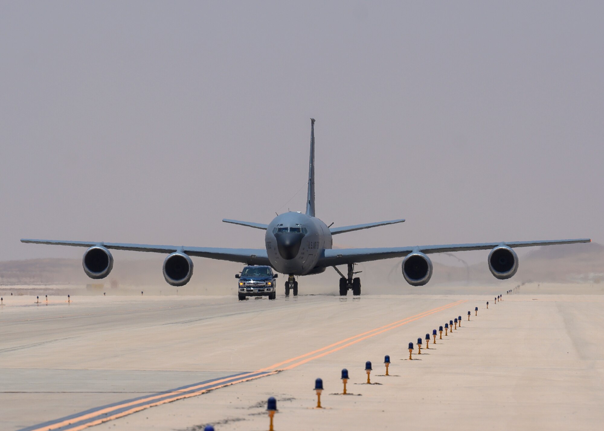 A U.S. Air Force KC-135 Stratotanker taxis to position for a hot-pit refueling, Prince Sultan Air Base, June 25, 2021. This event demonstrated the success of several weeks of hot-pit refueling cross-airframe training between 378th and 379th Air Expeditionary Wing maintainers, expanding both Wings ability to provide agile support for theater operations. (U.S. Air Force photo by Senior Airman Samuel Earick)