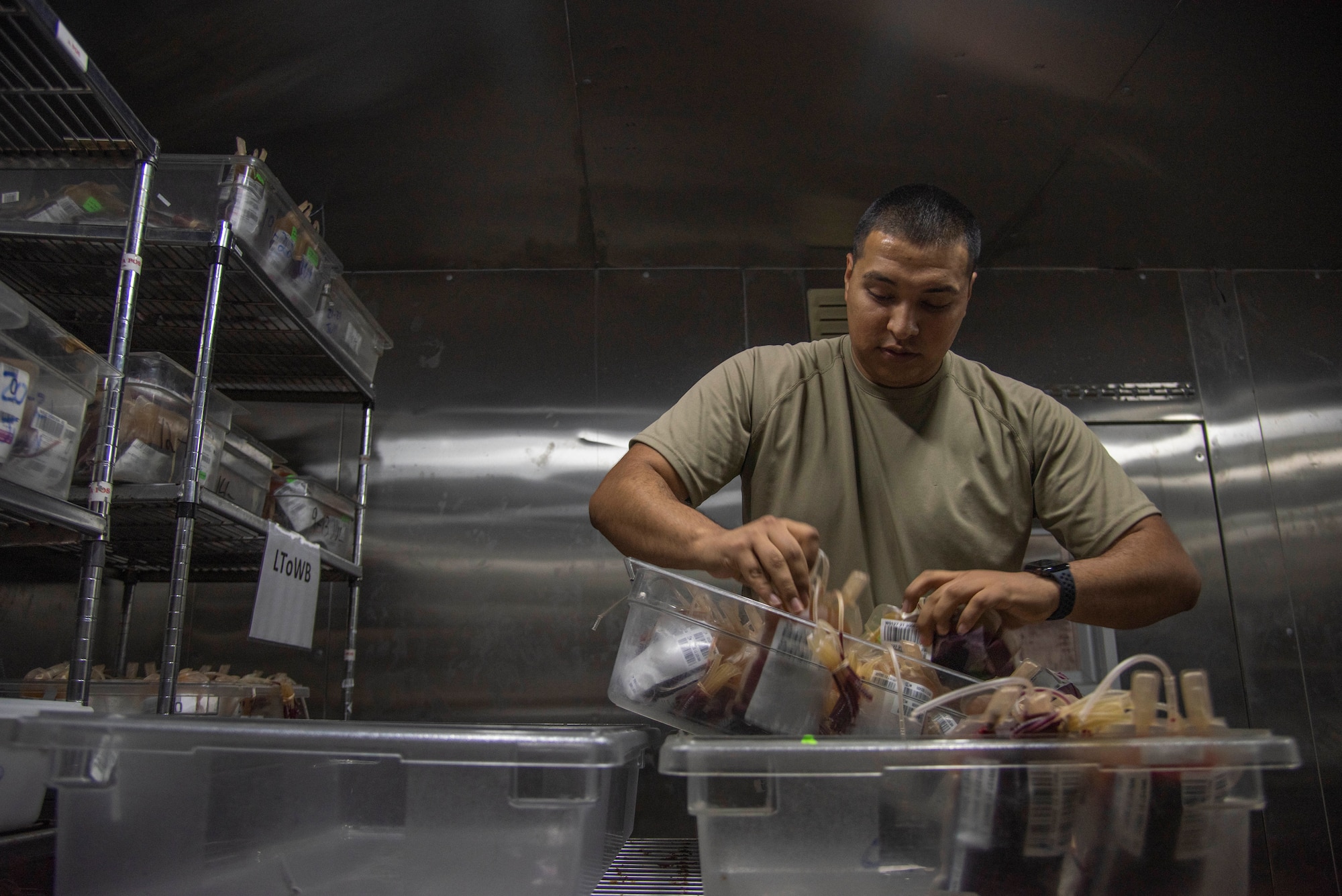 Tech. Sgt. Miguel Davila, 379th Expeditionary Medical Support Squadron medical logistics technician, sorts bags of blood July 1, 2021, at Al Udeid Air Base, Qatar.