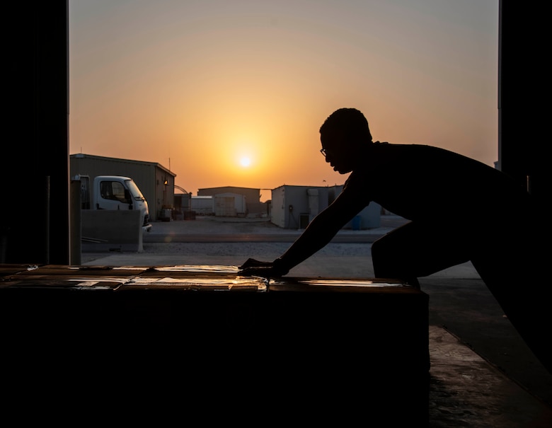 Staff Sgt. Cullen Sullivan, 379th Expeditionary Medical Support Squadron medical laboratory technician, packs boxes of blood products onto a pallet July 1, 2021, at Al Udeid Air Base, Qatar.