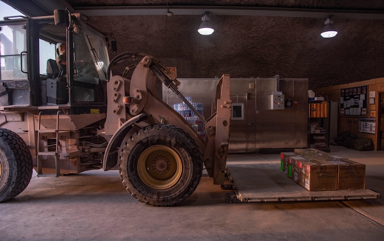Staff Sgt. Rachel Rhoads, 379th Expeditionary Medical Support Squadron blood transshipment center NCO in charge, prepares to move a pallet of packaged blood products July 1, 2021, at Al Udeid Air Base, Qatar.