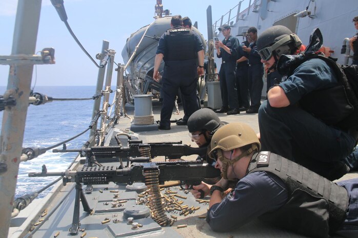 (July 4, 2021) Sailors aboard the Arleigh Burke-class guided-missile destroyer USS Donald Cook (DDG 75) man M240 machine guns during live fire gunnery exercises,  July 04, 2021. Donald Cook is on a scheduled deployment in the U.S. Sixth Fleet area of operations in support of U.S. national interests and security in Europe and Africa.