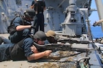 (July 4, 2021) Sailors aboard the Arleigh Burke-class guided-missile destroyer USS Donald Cook (DDG 75) man M240 machine guns during live fire gunnery exercises,  July 04, 2021. Donald Cook is on a scheduled deployment in the U.S. Sixth Fleet area of operations in support of U.S. national interests and security in Europe and Africa.