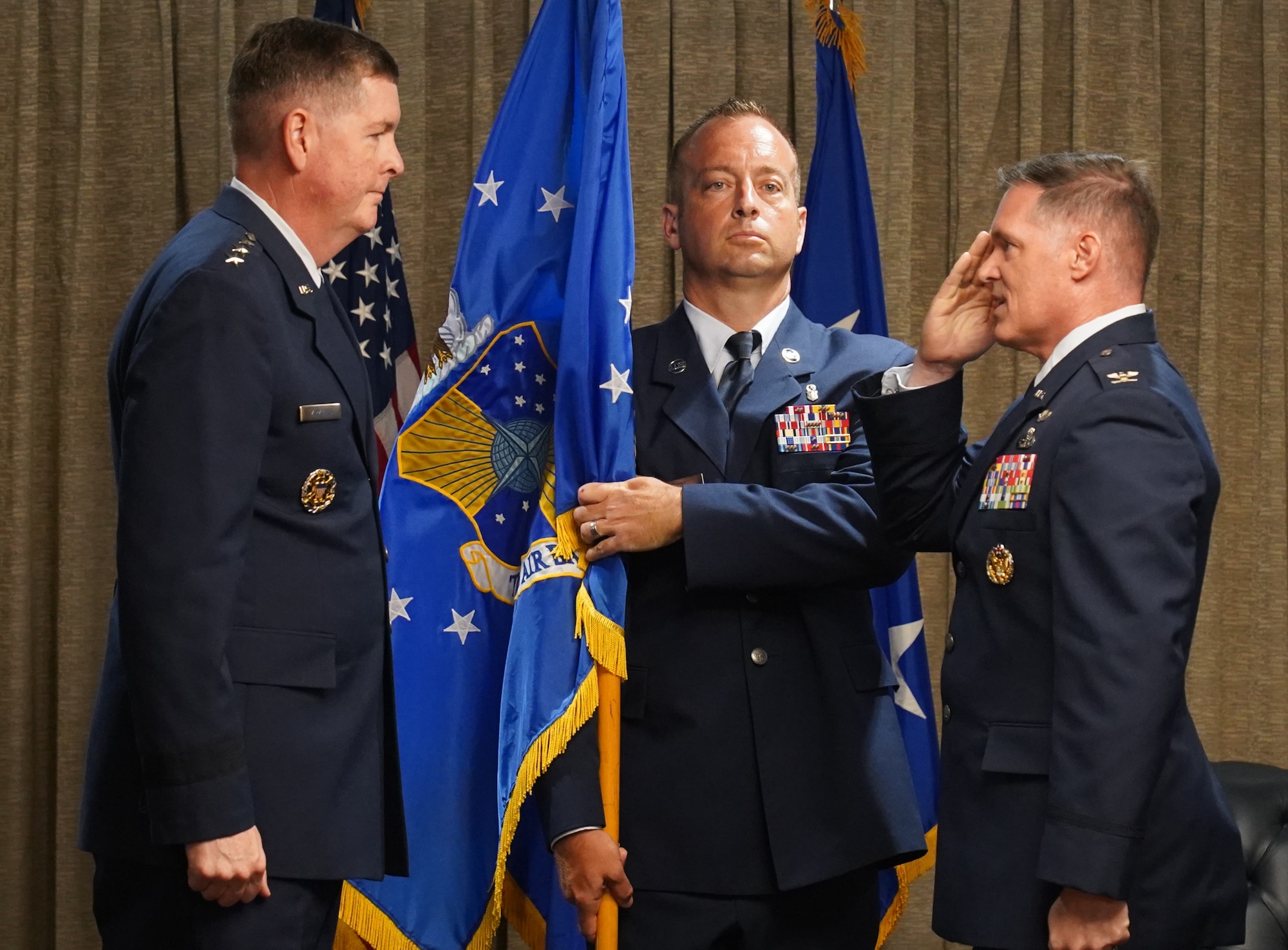 Lt. Gen. Kirkland (left) receiving salute from Col. Sebren (right).