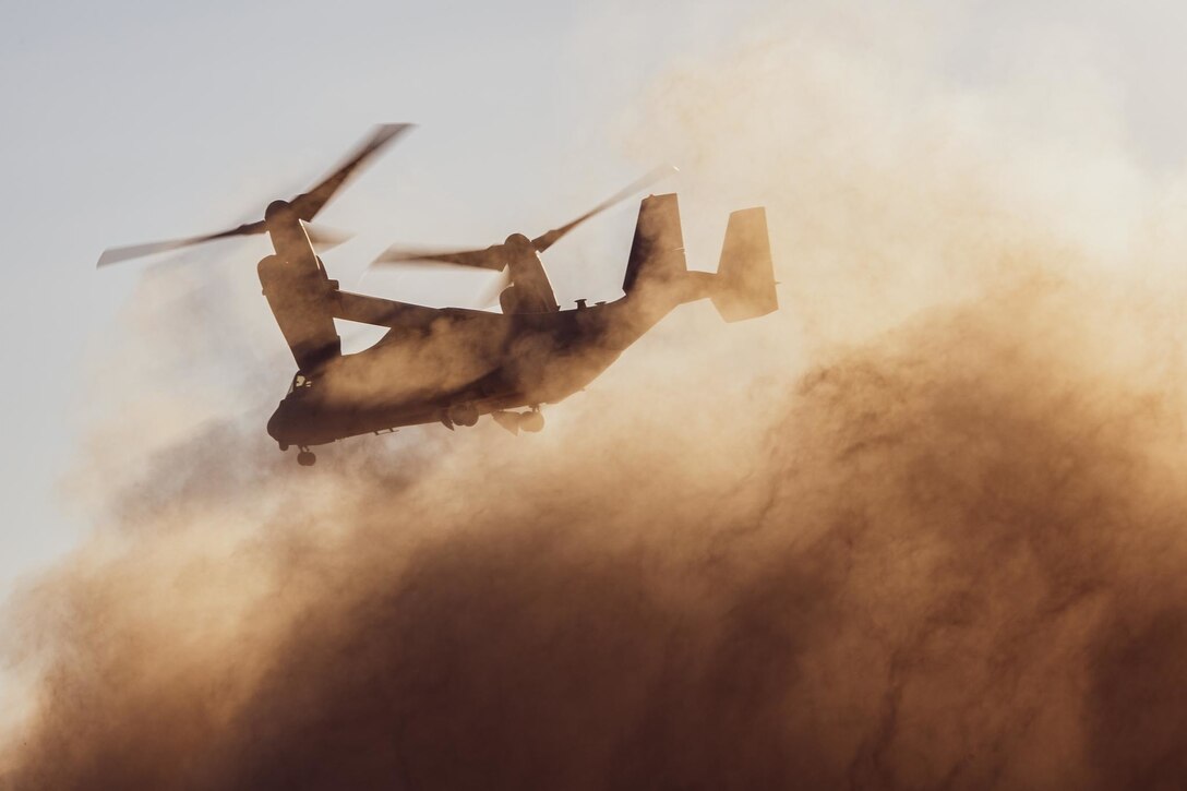210620-M-JU875-1002 TABUK, Saudi Arabia (June 20, 2021) - An MV-22B Osprey tiltrotor aircraft, attached to the 24th Marine Expeditionary Unit (MEU), takes off to conduct parachute operations during a theater amphibious combat rehearsal (TACR) in Tabuk, Kingdom of Saudi Arabia, June 20. TACR integrates U.S. Navy and Marine Corps assets to exercise a range of critical combat-related capabilities, both afloat and ashore. 24th MEU is deployed to the U.S. 5th Fleet area of operations in support of naval operations to ensure maritime stability and security in the Central Region, connecting the Mediterranean and Pacific through the western Indian Ocean and three strategic choke points. (U.S. Marine Corps photo by Cpl. Davis Harris)