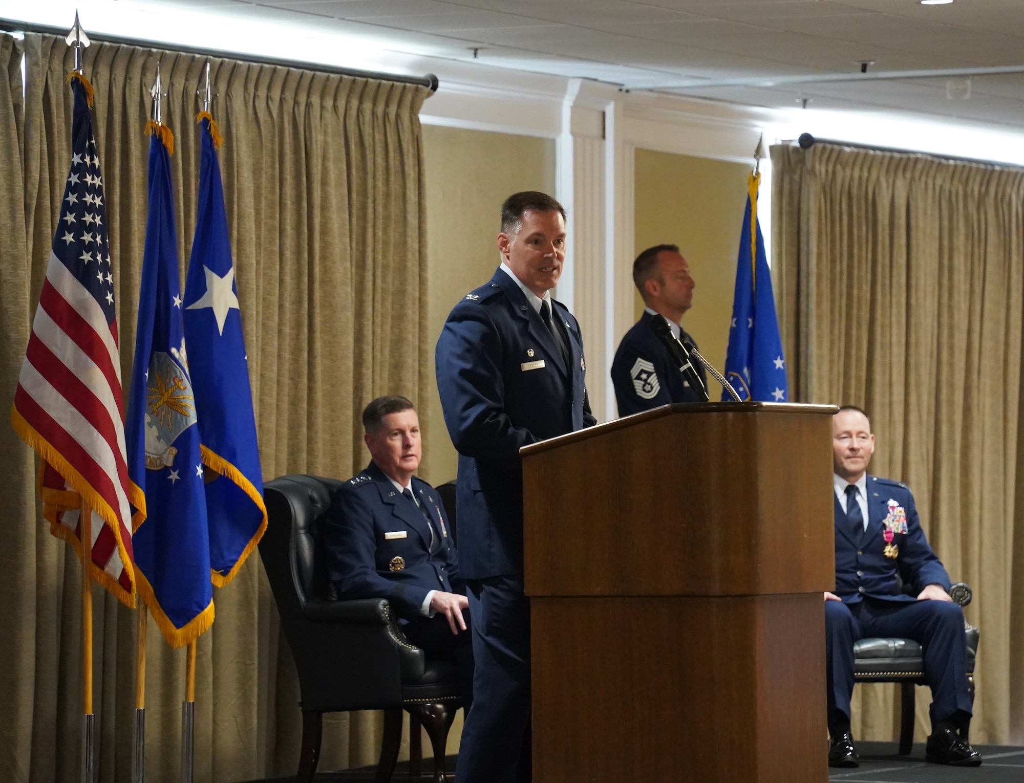 Col. Sebren speaking at change of command ceremony.
