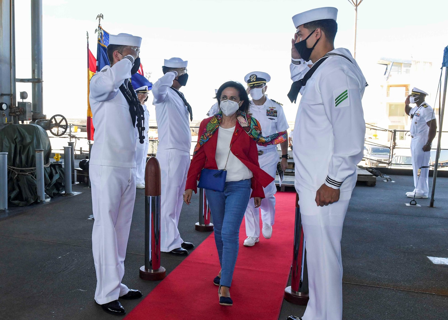 (July 8, 2021) Spanish Minister of Defense Margarita Robles walks through the side boys before receiving a tour aboard the Expeditionary Sea Base USS Hershel “Woody” Williams (ESB 4) in the Atlantic Ocean, July 8, 2021. Hershel “Woody” Williams is on a scheduled deployment in the U.S. Sixth Fleet area of operations in support of U.S. national interests and security in Europe and Africa.