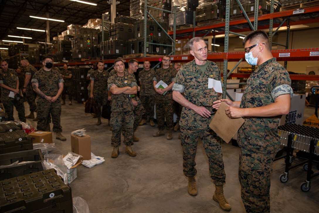 The Assistant Commandant of the Marine Corps (ACMC), Gen. Gary L. Thomas, visited Marines and Sailors with 2nd Marine Logistics Group at Camp Lejeune, North Carolina, July 7, 2021.  During the visit, the ACMC spoke to members of the unit about medical logistics and transportation capabilities of the 2nd MLG.  Recently the 2nd MLG provided support to COVID-19 FEMA operations and completed the longest convoy in Marine Corps history. (U.S. Marine Corps photo by Staff Sgt. Wesley Timm).
