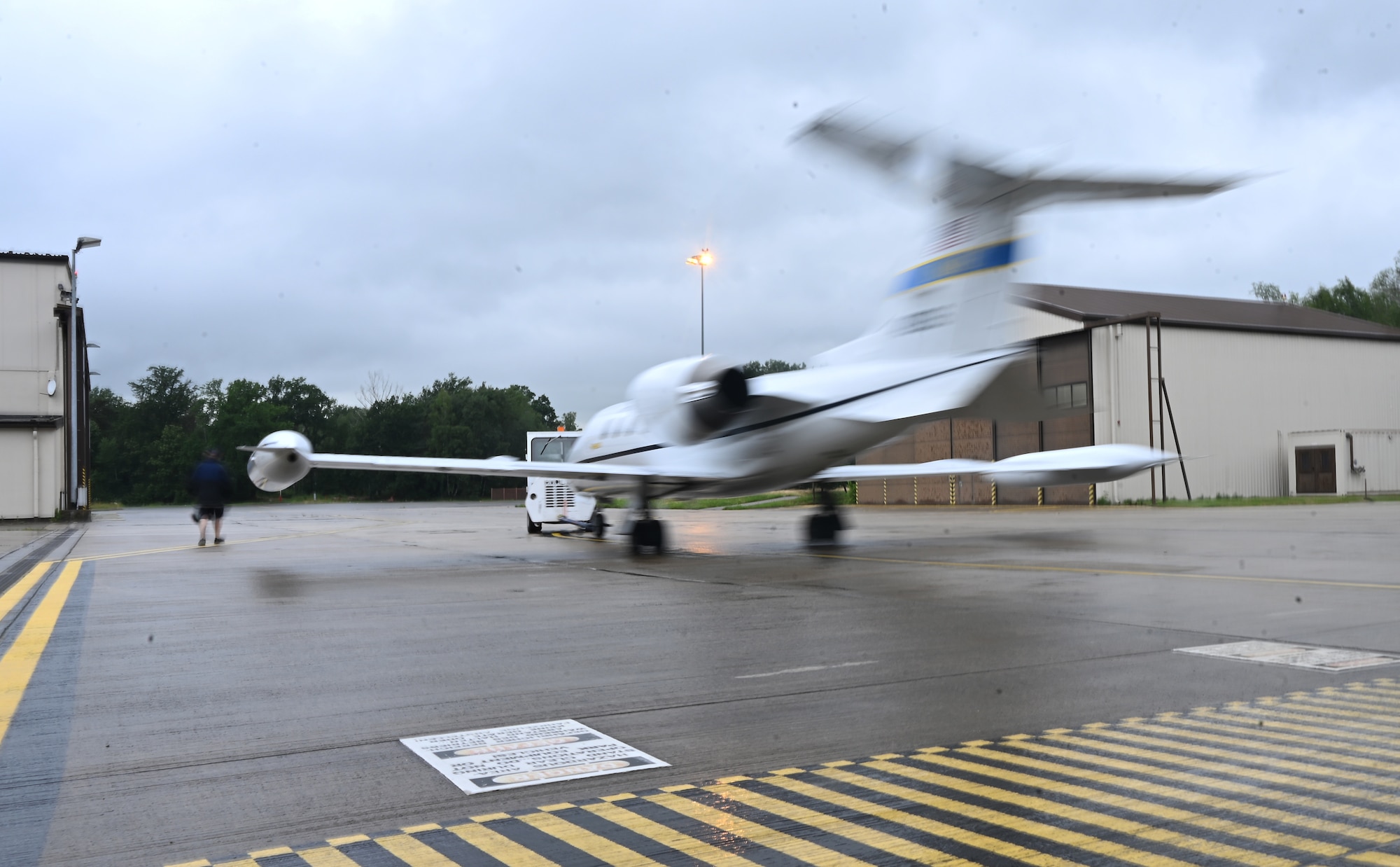 A C-21 aircraft assigned to the 76th Airlift Squadron is towed onto the flightline at Ramstein Air Base, Germany, July 8, 2021. The 76 AS performs multiple mission sets including distinguished visitor transport and aeromedical evacuation. (U.S. Air Force photo by Senior Airman Thomas Karol)