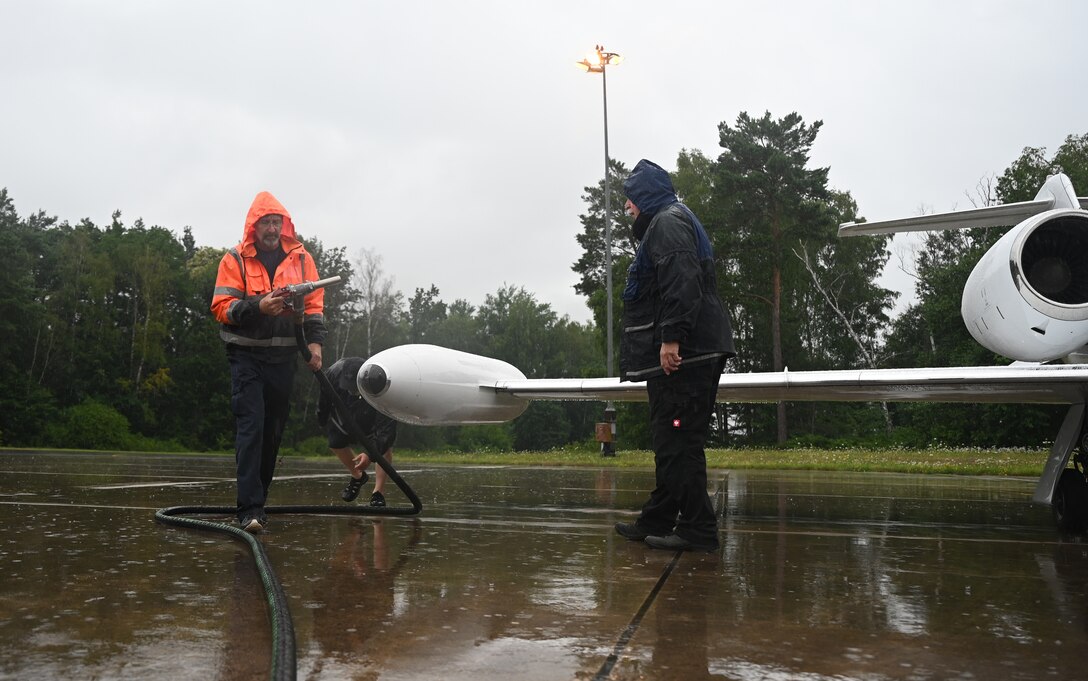 Henry Schwartz, 76th Airlift Squadron maintenance technician, removes a fuel hose from a C-21 aircraft at Ramstein Air Base, Germany, July 8, 2021. The 76th Airlift Squadron helped during the COVID-19 pandemic by delivering supplies such as personal protective equipment and test kits across the European theater. (U.S. Air Force photo by Senior Airman Thomas Karol)
