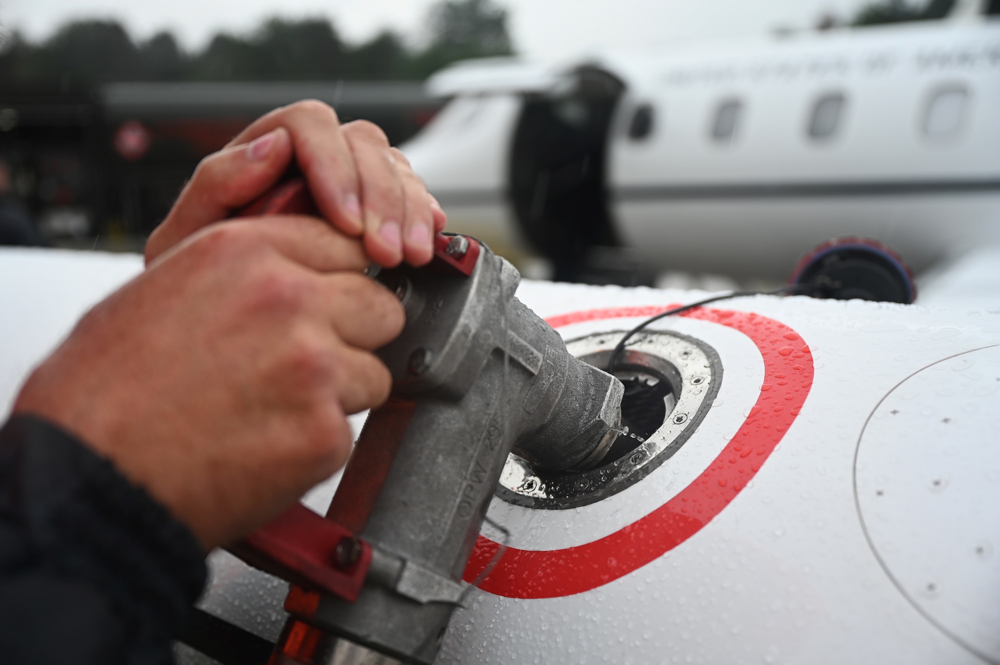 Henry Schwartz, 76th Airlift Squadron maintenance technician pumps fuel into a C-21 aircraft at Ramstein Air Base, Germany, July 8, 2021. The 76 AS is the world-class ready airlift squadron, which provides executive, operational and aeromedical airlift. (U.S. Air Force photo by Senior Airman Thomas Karol)