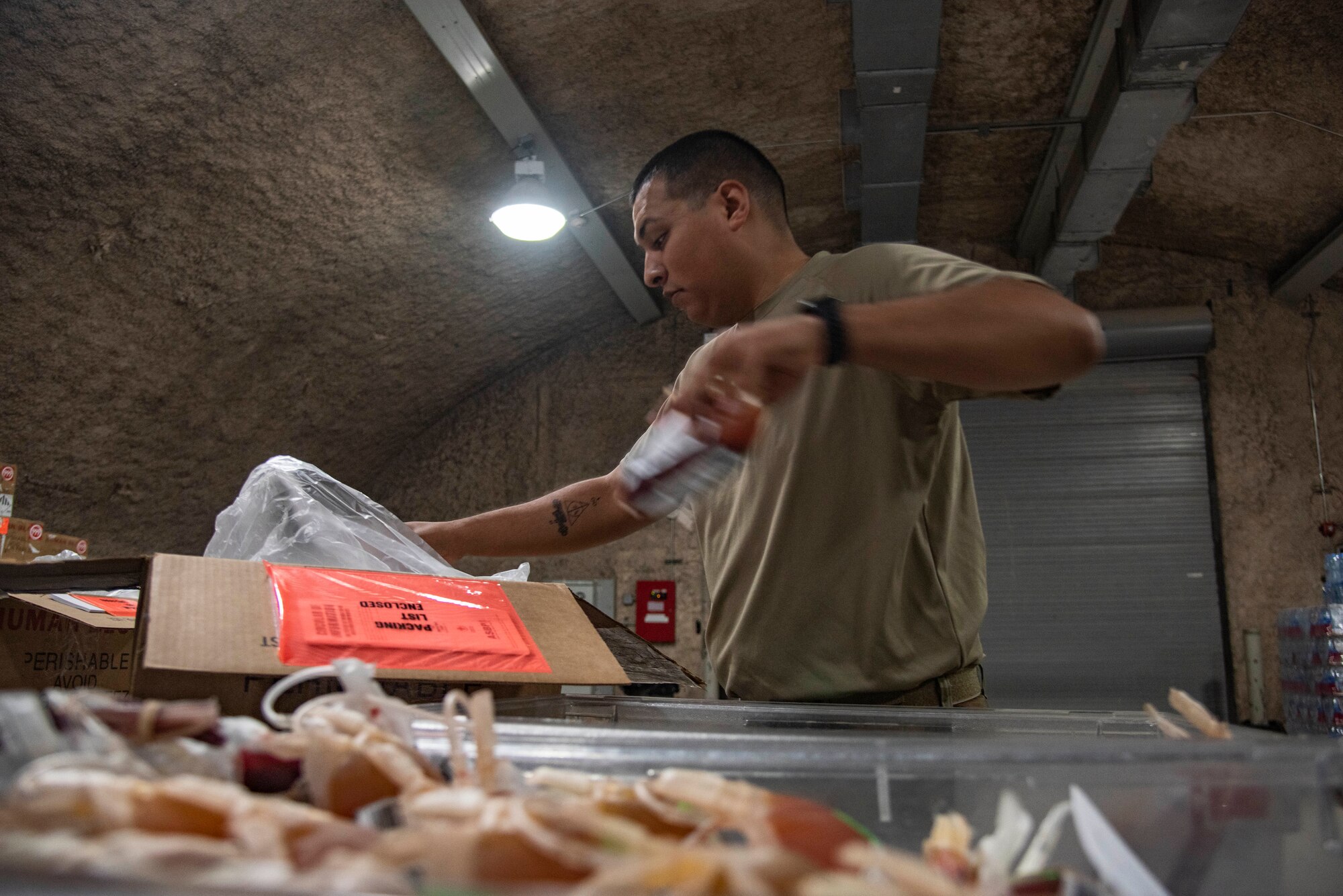Tech. Sgt. Miguel Davila, 379th Expeditionary Medical Support Squadron medical logistics technician, packs blood products July 1, 2021, at Al Udeid Air Base, Qatar.