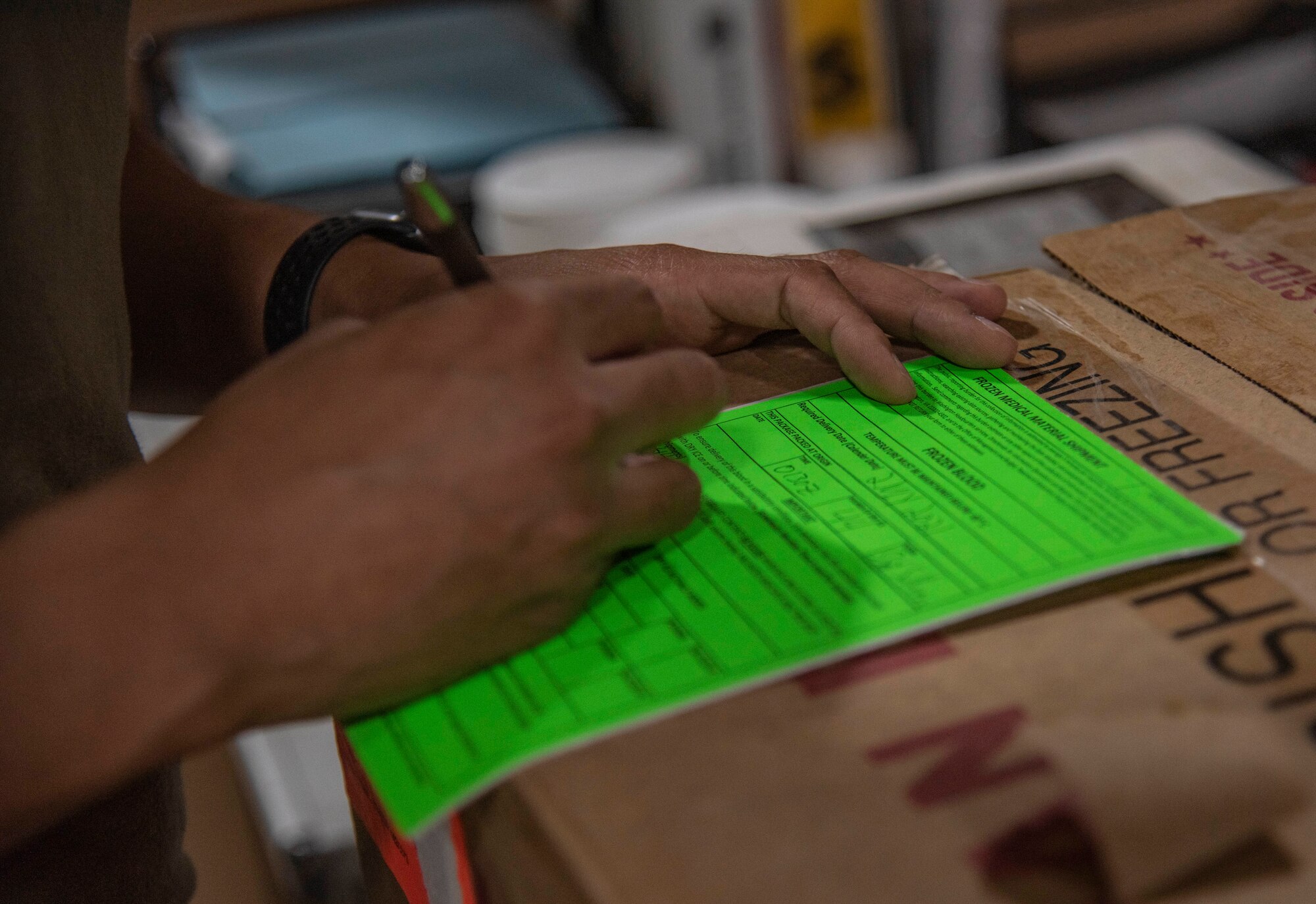 Staff Sgt. Cullen Sullivan, 379th Expeditionary Medical Support Squadron medical laboratory technician, fills out a blood shipment information sheet July 1, 2021, at Al Udeid Air Base, Qatar.