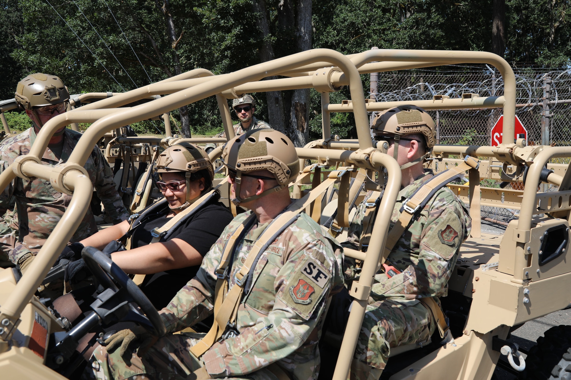 Betsy Dudley, the Military Legislative Assistant for Congresswoman Marilyn Strickland, receives a safety brief before riding a Razor off road, all-terrain vehicle with the 446th Security Forces Squadron July 6, 2021, on Joint Base Lewis-McChord, Washington.