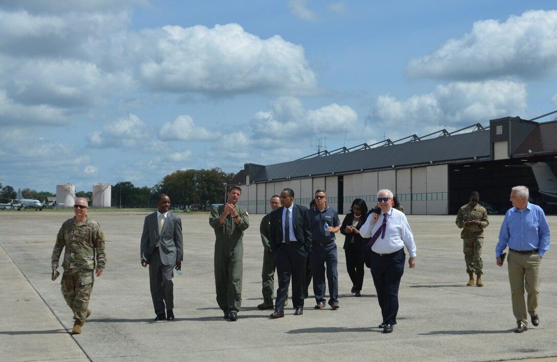 JOINT BASE ANDREWS, Md. - U.S. Navy Capt. Eddie Pilcher, Naval Air Facility Washington’s commanding officer, briefs JBA honorary commanders on their unique mission as they walk on the flightline during the Honorary Commanders Program quarterly visit at JBA, Md., June 25, 2021. The visit included a morning social with light refreshments at the Jones Building followed by the site visits to NAF-W, lunch at The Club, and an invitation to participate in a 316th Wing leadership meeting. (U.S. Air Force courtesy photo)